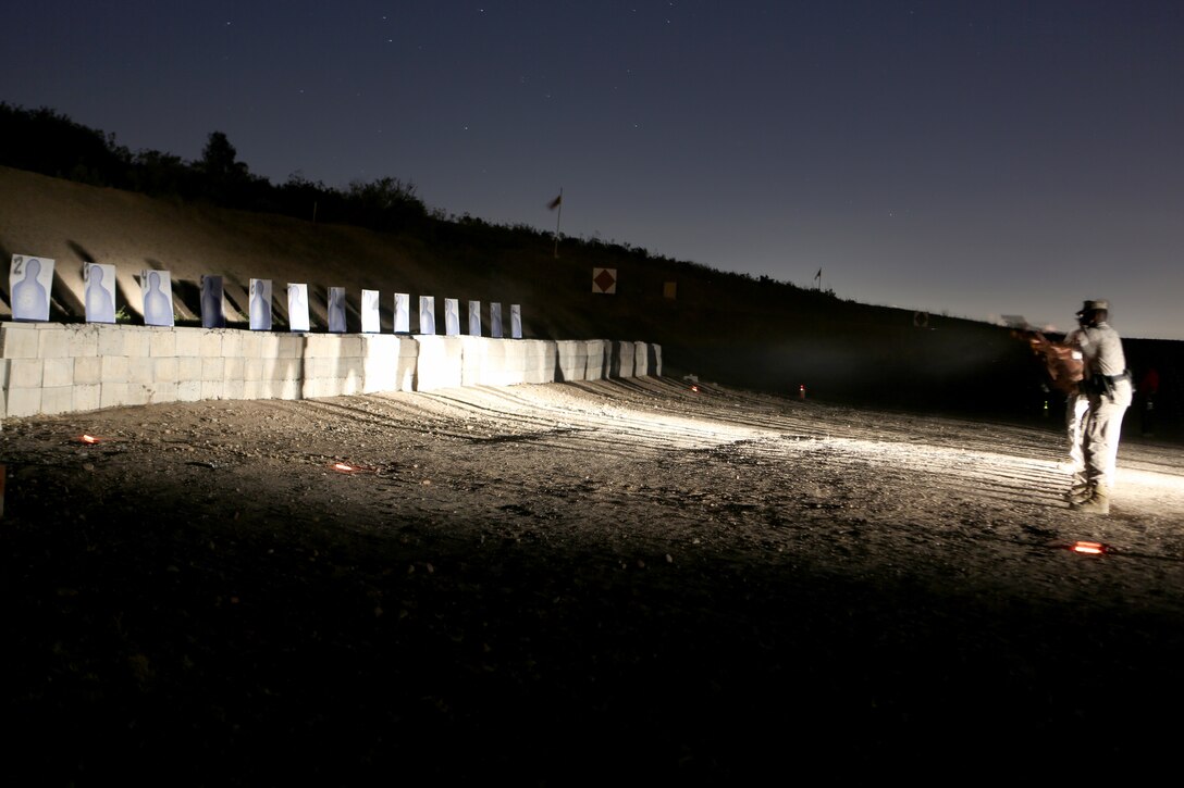 Marines and police officers with the Marine Corps Air Station Miramar Provost Marshal’s Office conduct a live-fire training exercise in low-light conditions aboard MCAS Miramar, Calif., June 18. The Marines and police officers also conducted a practical weapons course as part of the annual training requirements.
