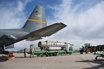 Airmen assigned to the 153rd Airlift Wing, Wyoming Air National Guard, prepare to load a U.S. Forest Service Modualar Airborne Firefighting System II onto a Wyoming Air Guard C-130 Hercules, April 13, 2012. The annual training maintains currency and upgrade qualifications for pilots, aircrew and ground crews in preparation for the fire season