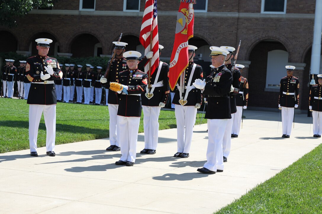 On June 20, 2014, Commandant of the Marine Corps Gen. James Amos presented Medal of Honor recipient Cpl. Kyle Carpenter with the Medal of Honor flag at a special ceremony at Marine Barracks Washington, D.C. (U.S. Marine Corps photo by Master Sgt. Kristin duBois/released)