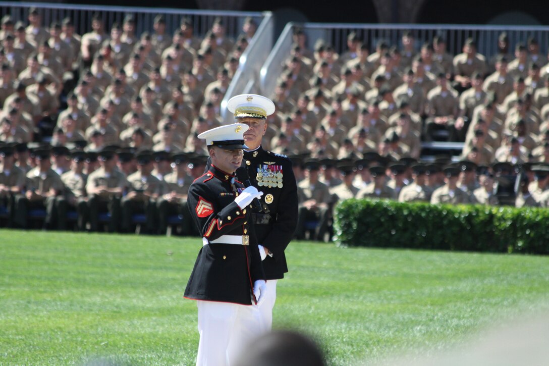 On June 20, 2014, Commandant of the Marine Corps Gen. James Amos presented Medal of Honor recipient Cpl. Kyle Carpenter with the Medal of Honor flag at a special ceremony at Marine Barracks Washington, D.C. (U.S. Marine Corps photo by Master Sgt. Kristin duBois/released)