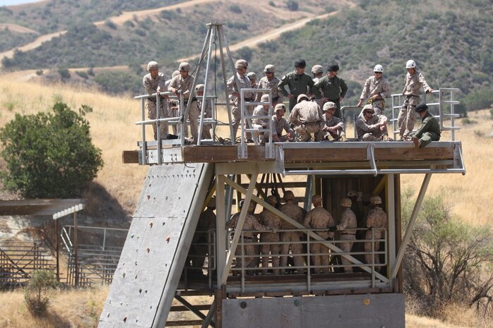 Marines with 2nd Battalion, 4th Marine Regiment and 2nd Battalion, 7th Marine Regiment, practice rappel techniques during the Helicopter Rope Suspension Techniques course aboard Camp Pendleton, Calif., June 16, 2014. These Marines were educated on tying knots, fast roping and rappelling from towers and helicopters to become HRST masters. (U.S. Marine Corps photo by Lance Cpl. Tony Simmons)