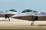 Two U.S. Air Force F-22 Raptor fighters taxi into the Louisville Air National Guard Base in Louisville, Ky. April 18, 2012 prior to the 2012 Thunder Over Louisville Air Show. The Raptor Demo Team, based out of Langley Air Force Base, Va., will be one of the show's marquee events. The Kentucky Air Guard is once again supporting military aircraft for Thunder, which has grown to become one of the largest air shows in North America, organizers say.