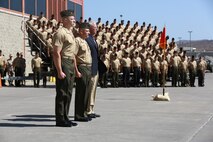 Lieutenant Col. Gilbert D. Juarez (left), past commanding officer for 1st Light Armored Reconnaissance Battalion, 1st Marine Division, I Marine Expeditionary Force, Lt. Col. Christian M. Rankin (middle), present commanding officer for 1st LAR, 1st Marine Division, I MEF, and retired Lt. Col. Clifford O. Meyers (right), a former commanding officer for 1st LAR, 1st Marine Division, I MEF, stand at attention during the pass in review portion of a change of command ceremony aboard Camp Pendleton, Calif., June 19, 2014. It is a tradition to invite former commanding officers to join the off-going and on-coming commanders during the pass and review. (U.S. Marine Corps photo by Lance Cpl. Anna Albrecht)