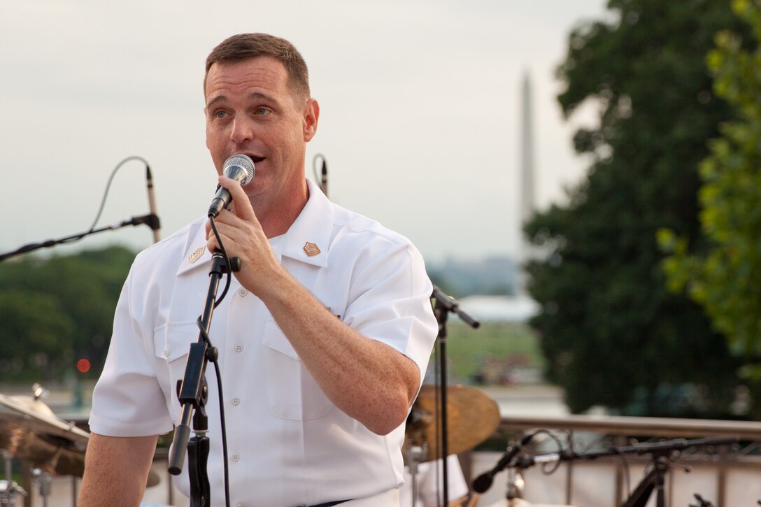 Master Sgt. Kevin Bennear sings with Free Country, the Marine Band's contemporary country music ensemble, on the west steps of the U.S. Capitol. (U.S. Marine Corps photo by Staff Sgt. Brian Rust/released)