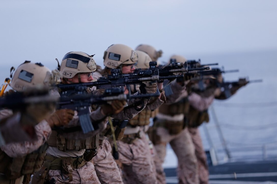 Marines with the Force Reconnaissance Detachment, 11th Marine Expeditionary Unit, fire their M4 carbines for a close quarters tactics qualification range on the flight deck of the USS San Diego during Certification Exercise (CERTEX) off the coast of Southern California, June 19, 2014. CERTEX serves as the final at-sea period for the 11th MEU and PHIBRON 5. It is designed to strengthen the blue-green team's ability to operate together and to respond to various situations while deployed. (U.S. Marine Corps photo by Cpl. Jonathan R. Waldman/RELEASED)