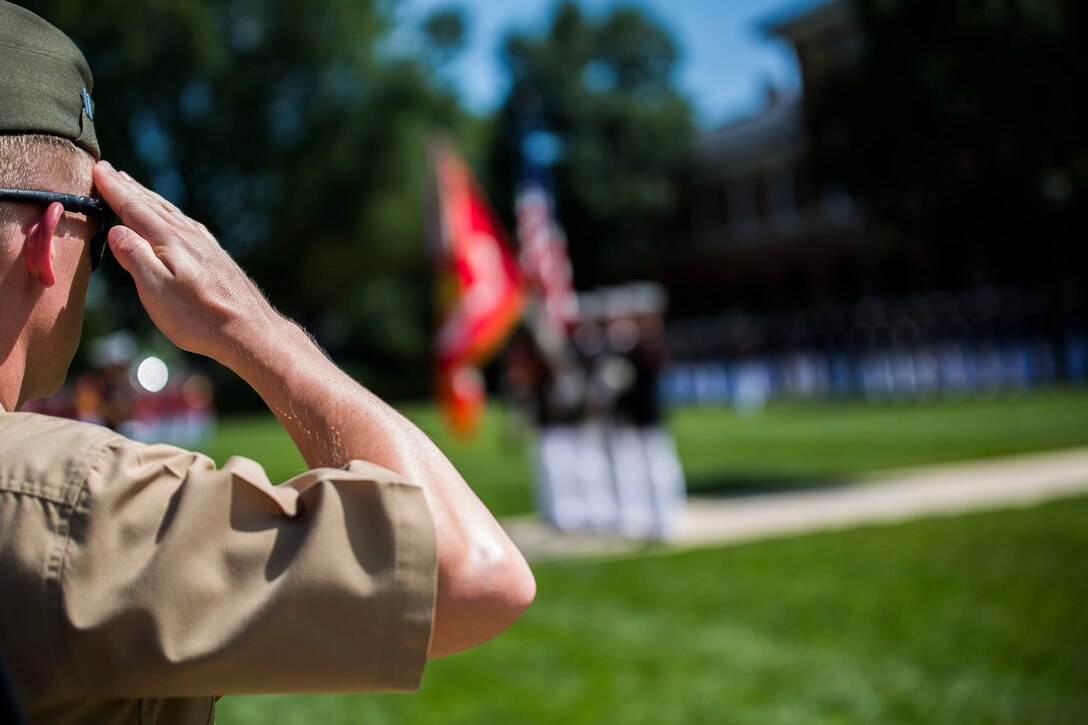 A Marine renders a salute during the Medal of Honor Flag Presentation Ceremony for Cpl. Kyle Carpenter, Medal of Honor recipient, at Marine Barracks Washington, D.C., June 20, 2014. Carpenter recieved his Medal of Honor flag during a parade in his honor at the Barracks, June 20. Carpenter is the third Marine to recieve the Medal of Honor since the beginning of Operations Iraqi Freedom and Enduring Freedom. (Official Marine Corps photo by Cpl. Dan Hosack/Released)