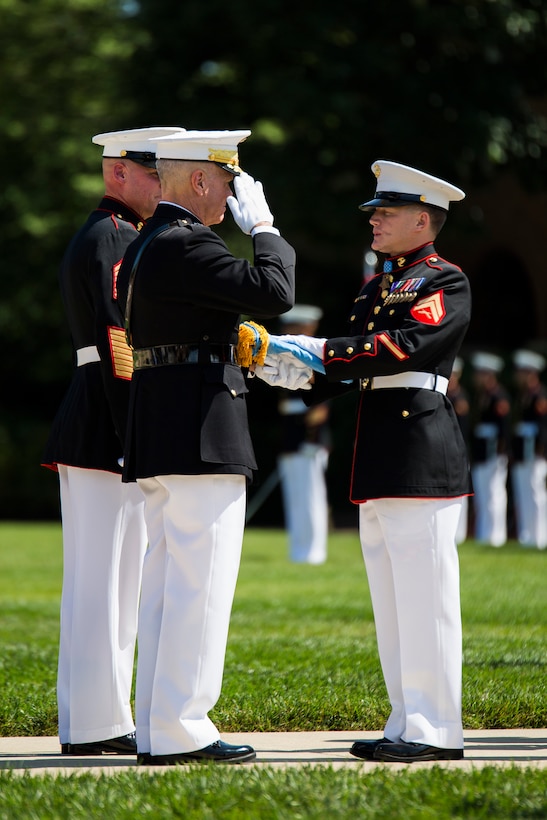 Cpl. Kyle Carpenter, Medal of Honor recipient, recieved his Medal of Honor flag during a parade in his honor at Marine Barracks Washington, D.C., June 20, 2014. Carpenter is the third Marine to recieve the Medal of Honor since the beginning of Operations Iraqi Freedom and Enduring Freedom. (Official Marine Corps photo by Cpl. Dan Hosack/Released)