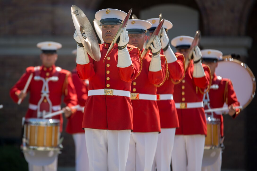 The United States Marine Drum & Bugle Corps, performs during a parade for Cpl. Kyle Carpenter, Medal of Honor recipient,  at Marine Barracks Washington, June 20, 2014. Carpenter is the third Marine to recieve the Medal of Honor since the beginning of Operations Iraqi Freedom and Enduring Freedom.