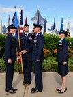 Lt. Col. Michael Fea, former 15th Medical Operations Squadron commander, center, renders a salute to Col. Virgina Garner, 15th Medical Group commander, left, just prior to officially handing over command to Lt. Col. Jennifer Vecchione, right, in a ceremony at the Missing Man Formation on Joint Base Pearl Harbor-Hickam, Hawaii, June 20, 2014. Fea is headed to attend the Air War College at Maxwell Air Force Base, Al. (U.S. Air Force photo/Tech. Sgt. Terri Paden)