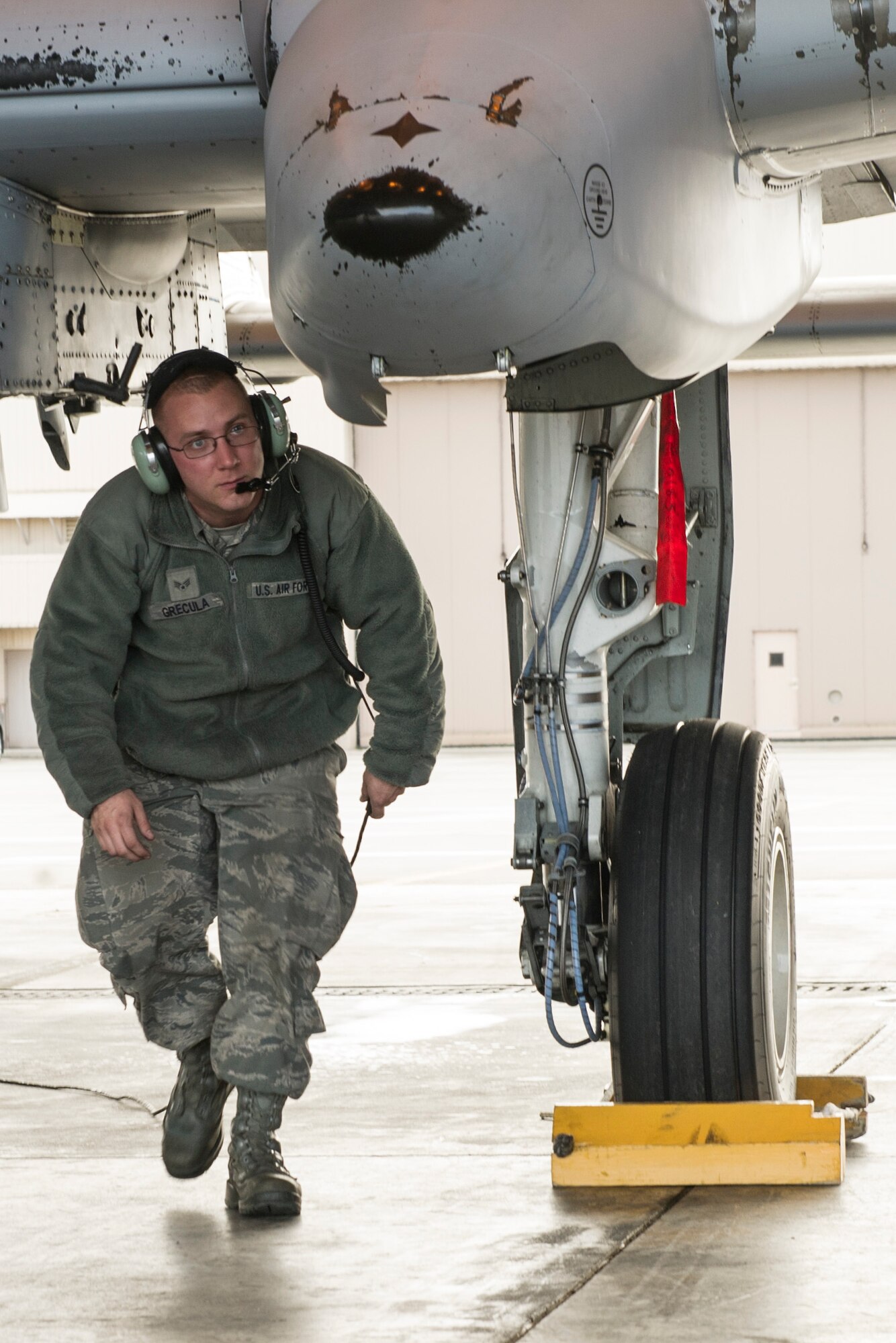 U.S. Air Force Senior Airman Eric Brecula, 51st Aircraft Maintenance Squadron maintainer assigned to Osan Air Base, South Korea, performs pre-flight inspections during RED FLAG-Alaska 14-2 June 20, 2014, Eielson Air Force Base, Alaska. RF-A is a multinational, joint exercise enablining air crew and maintenance units to test their capabilities in a simulated deployed environment. (U.S. Air Force photo by Senior Airman Joshua Turner/Released)