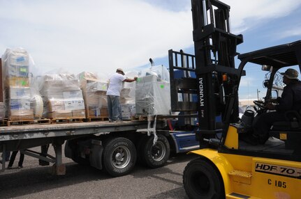 Humanitarian aid and supplies are loaded onto a freight truck bound for Honduran citizens in need at Soto Cano Air Base, Honduras, June 13, 2014.  Over 29,000 pounds of supplies were sent to Honduras through the Denton Program, which allows private U.S. citizens and organizations to use space available on U.S. military cargo planes to transport humanitarian goods to approved countries in need.  (Photo by U. S. Air National Guard Capt. Steven Stubbs)