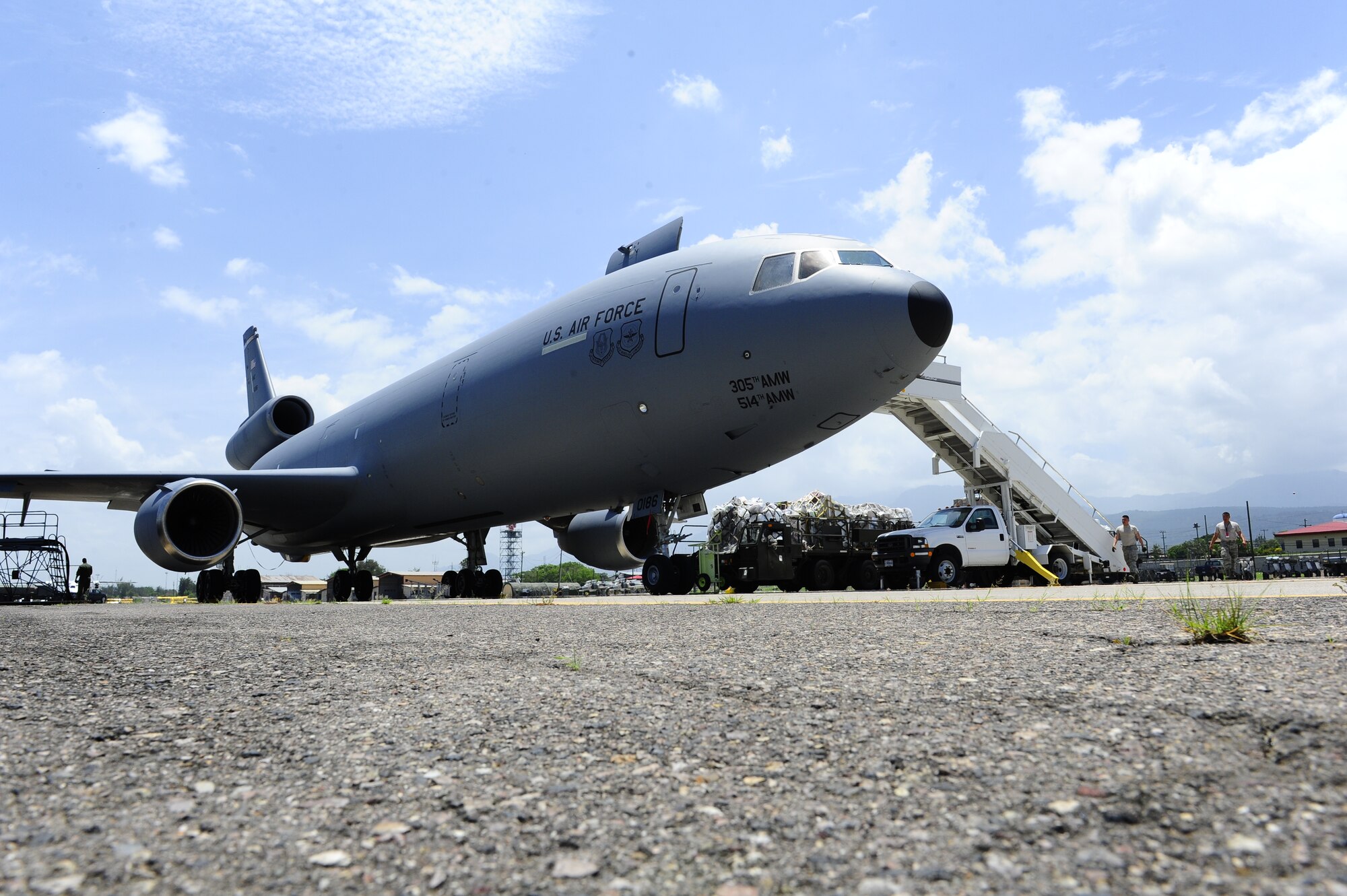 Over 29,000 pounds of humanitarian aid and supplies are unloaded from a U. S. Air Force KC-10 Extender bound for Honduran citizens in need by the 612th Air Base Squadron at Soto Cano Air Base, Honduras, June 6, 2014.  The supplies were sent to Honduras through the Denton Program, which allows private U.S. citizens and organizations to use space available on U.S. military cargo planes to transport humanitarian goods to approved countries in need.  (Photo by Martin Chahin)