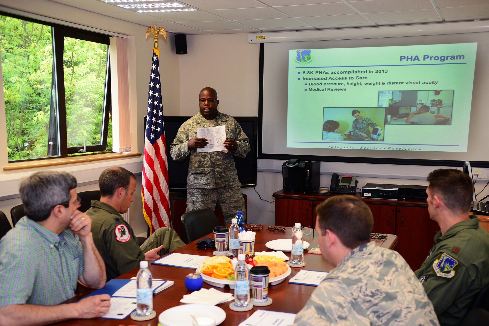 Staff Sgt. Nigel Bain, 48th Aerospace Medical Squadron public health craftsman, gives commanders insight on the physical health assessment process during an AMDS immersion day at Royal Air Force Lakenheath, England, June 19, 2014. The event was held to provide commanders with an opportunity to see the various elements of the squadron and how each unit supports the commander’s Airmen. (U.S. Air Force photo by Staff Sgt. Emerson Nuñez/Released)