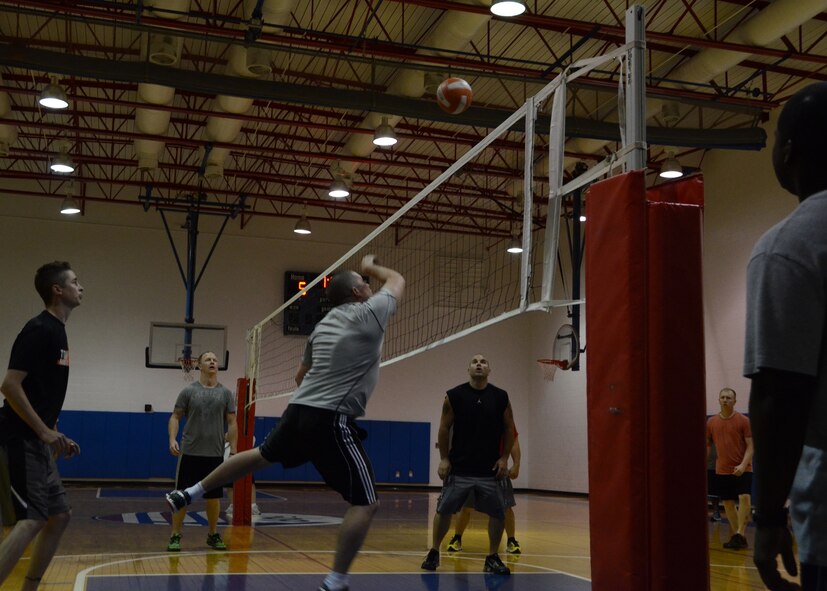 After a hard charging day of active duty training at Whiteman Air Force Base, Missouri Air National Guardsmen of the 131st Medical Group and 131st Maintenance Squadron took to the courts of the Fitness Center for a friendly, but competitive game of volleyball. (U.S. Air National Guard photo by Airman Halley Burgess)