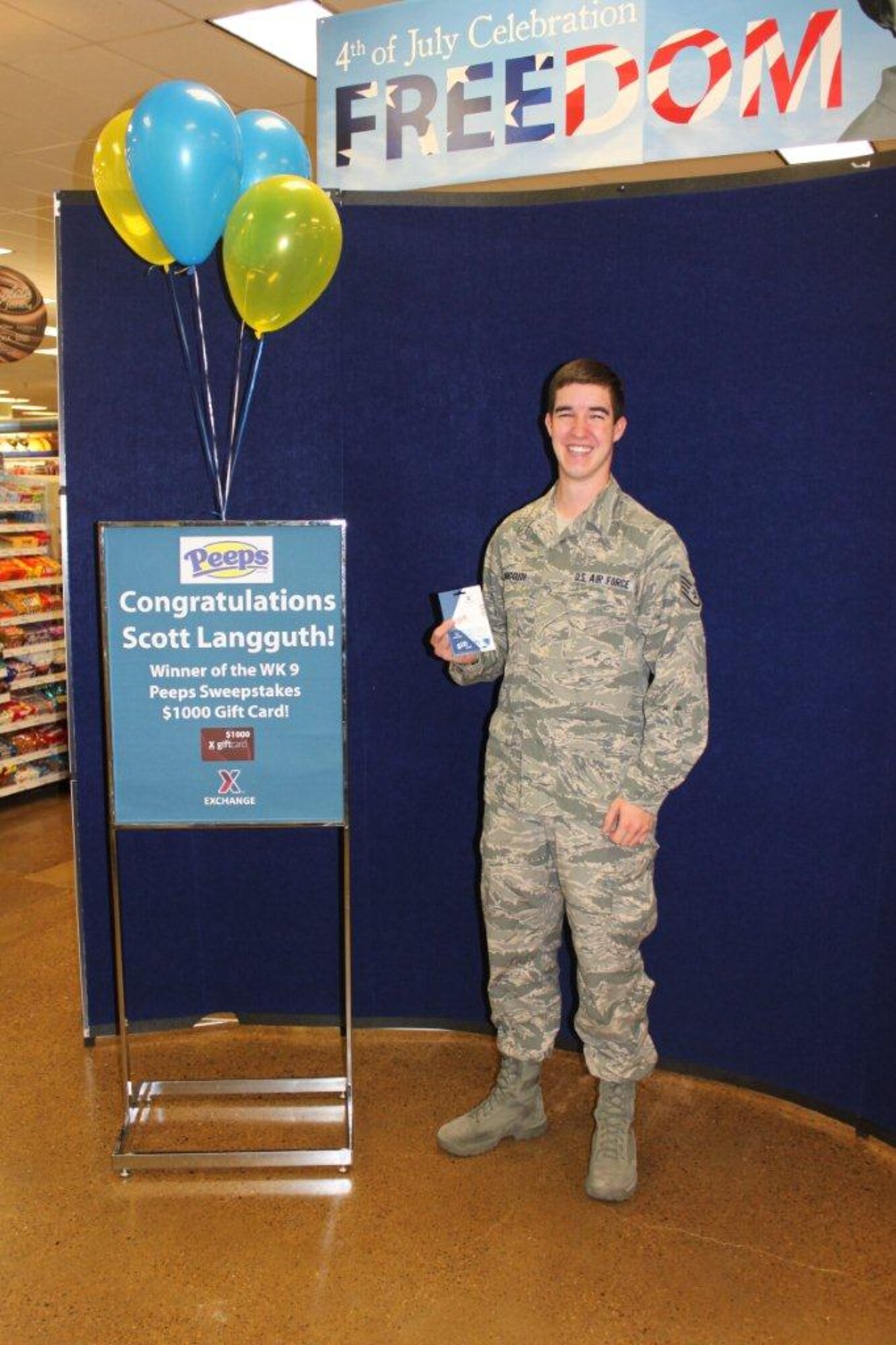 U.S. Air Force Staff Sgt. Scott Langguth, 27th Special Operations Support Squadron Air Traffic Controller, is presented with a $1,000 AAFES gift card, June 18, 2014 during a brief prize presentation at the Base Exchange at Cannon Air Force Base, N.M. (Courtesy photo)