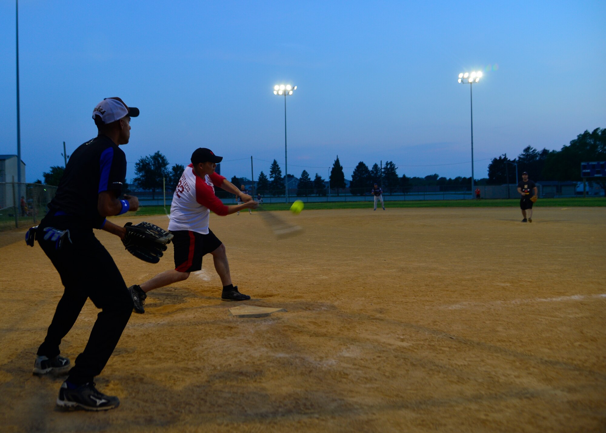 Joseph Constancio, 436th Aerial Port Squadron center fielder, hits a fly ball into right field during an intramural softball game June 18, 2014, at the softball field on Dover Air Force Base, Del. The 436th APS fell short to the 436th Security Forces Squadron, 11-8. (U.S. Air Force photo/Airman 1st Class William Johnson)