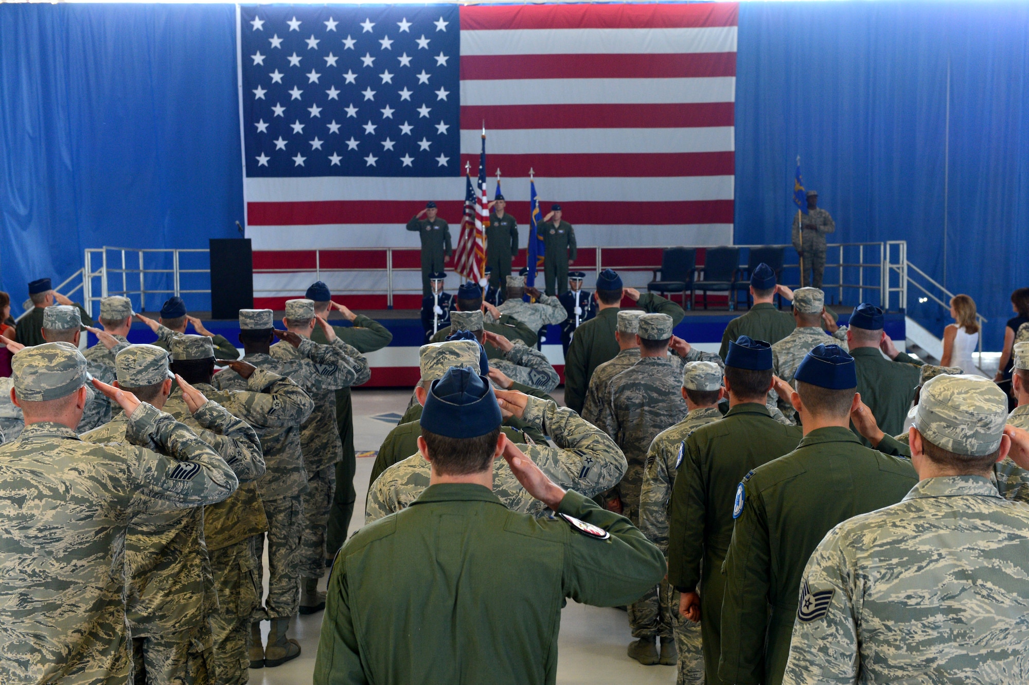 U.S. Air Force Airmen from the 495th FG render salutes during a change of command ceremony at Shaw Air Force Base, S.C., June 20, 2014. Col. Juris Jansons relinquished command to Col. James McCune, who to came to Shaw from the Pentagon. (U.S. Air Force photo by Airman 1st Class Jensen Stidham/Released)