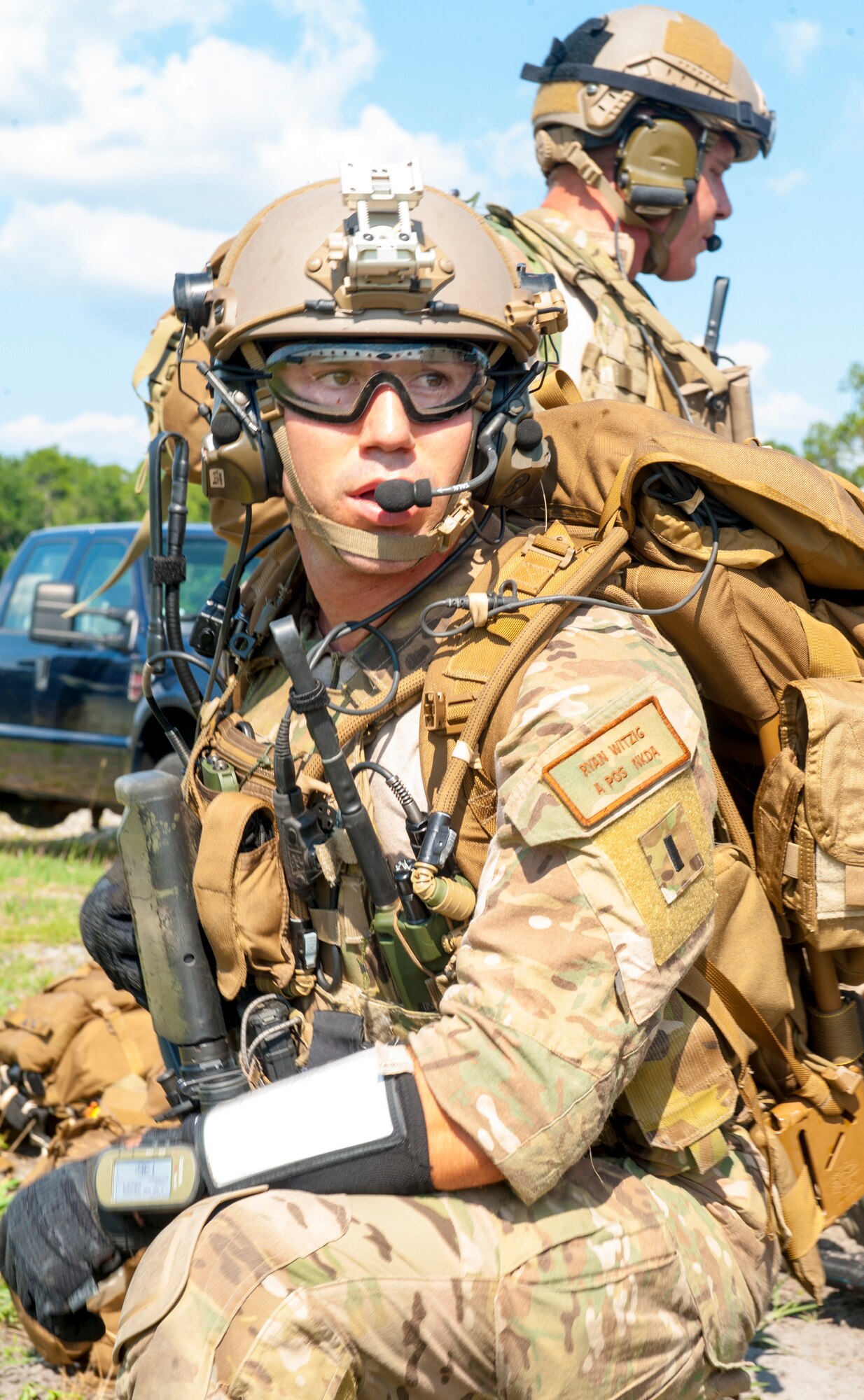 U.S. Air Force 1st Lt. Ryan Witzig, 38th Rescue Squadron combat rescue officer, watches for opposing forces while fellow pararescuemen treat victims during a combat search and rescue (CSAR) exercise at Moody Air Force Base, Ga., June 18,2014. Moody’s pararescuemen train for real life missions both deployed and at home. (U.S. Air Force photo by Airman 1st Class Ceaira Tinsley/Released)