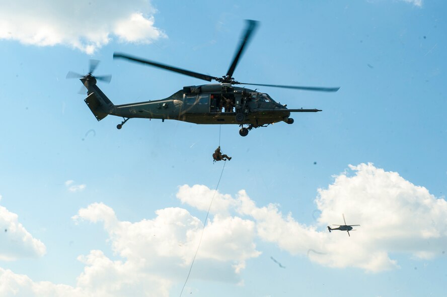 Pararescuemen from the 38th Rescue Squadron, rappel from an HH-60G Pave Hawk during a combat search and rescue training exercise at Moody Air Force Base, GA., June 18, 2014. The CSAR exercise was part of a four-day event that exposed U.S. Air Force cadets to the daily life of a combat rescue officer .  (U.S. Air Force photo by Airman 1st Class Ceaira Tinsley/Released)