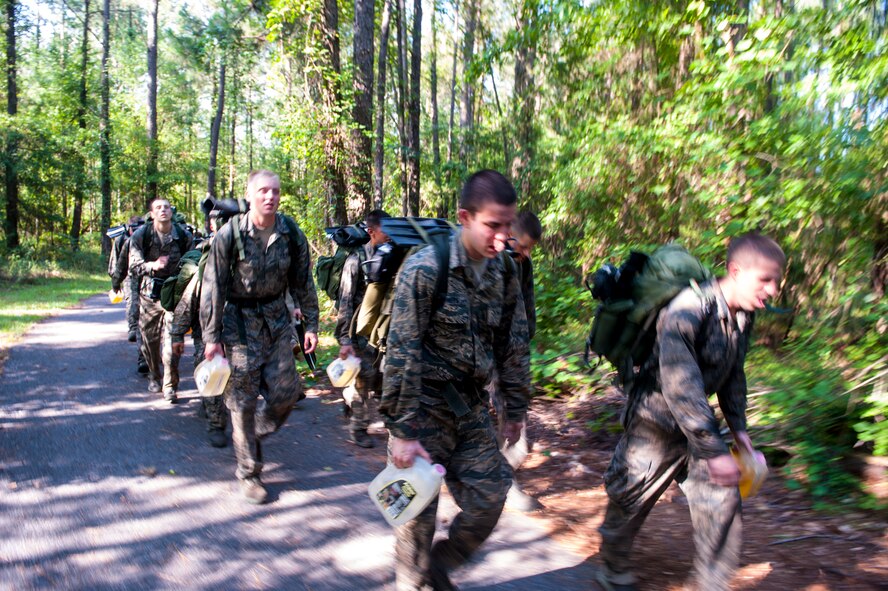 U.S. Air Force cadets push through a three-mile ruck march at Moody Air Force Base, Ga., June 17, 2014. The cadets came from different detachments from across the United States,  but they quickly learned that teamwork would get them through the week. (U.S. Air Force photo by Airman 1st Class Ceaira Tinsley/Released)
