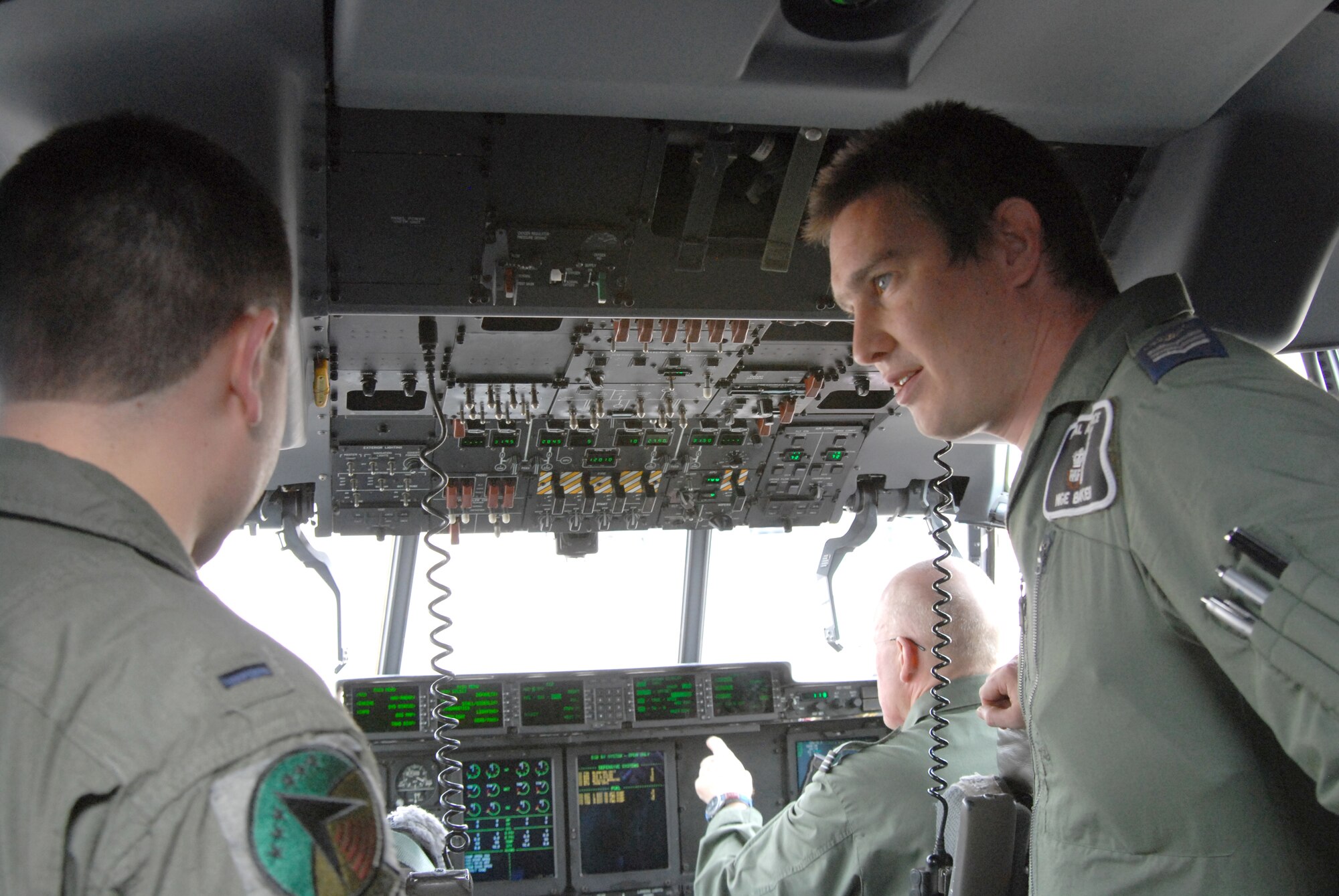 Left, 1st Lt. Drew Wentz, 193rd Special Operations Group co-pilot, gets a tour of a Royal Air Force aircraft by Sgt. Nigel Baker, RAF 33 Engineer Squadron. RAF troops arrived at the 193rd Special Operations Wing recently to participate in the Keystone Forge bilateral training exercise with the 193rd SOG and to conduct proficiency flying in the local area. (U.S. Air National Guard photo by Staff Sgt. Susan Penning/Released)