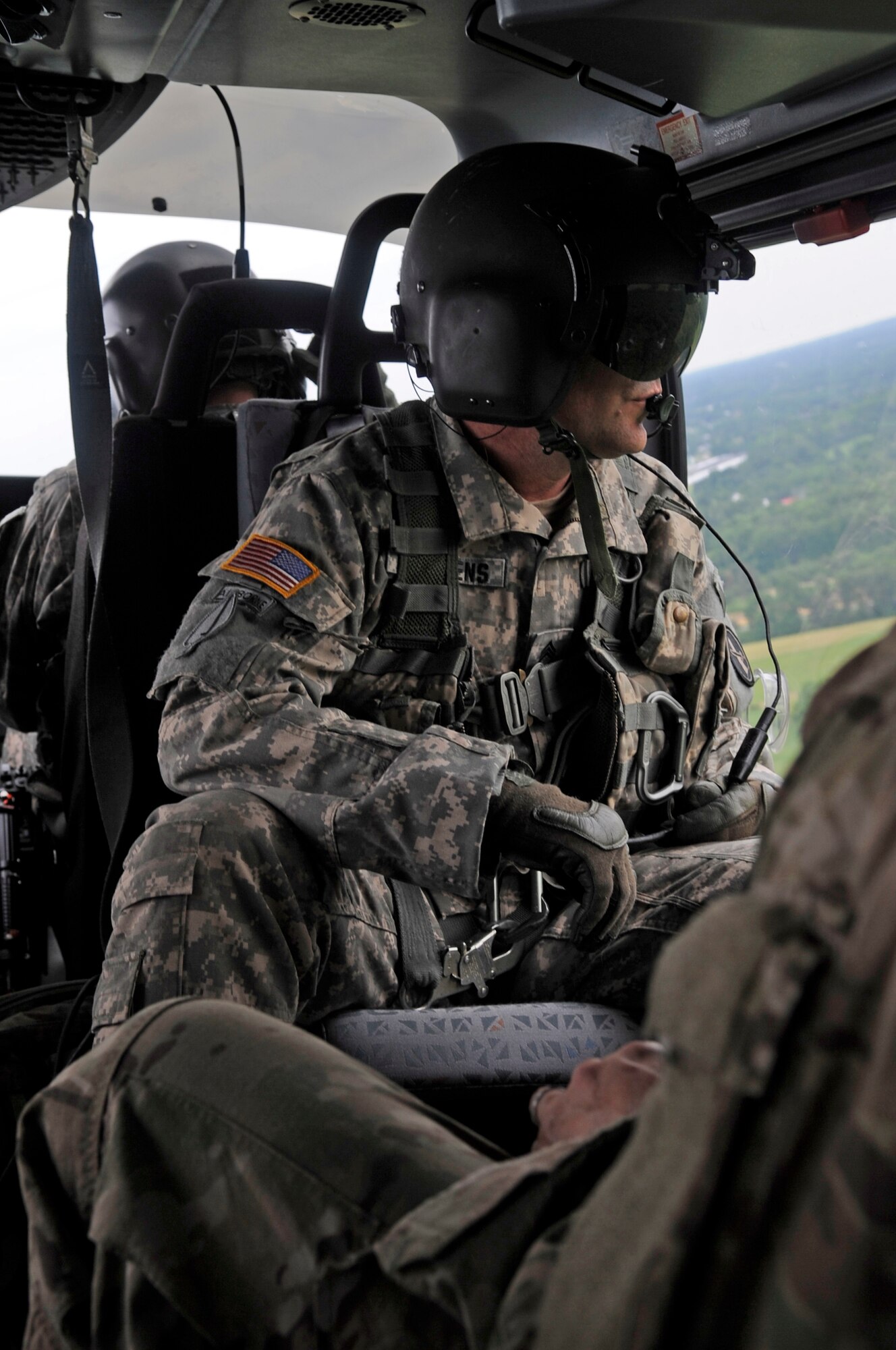 Sgt. 1st Class James Stephens, Bravo Company 12th Aviation platoon sergeant, scans for students during survival, evasion, resistance, and escape training, in Gambrills, Md., June 6, 2014.  The training focuses on evading capture, survival skills, and the military code of conduct. SERE is mandatory for aircrew and personnel required to maintain Code of Conduct Continuation Training. Skills gained at SERE are tailored for specific aircraft, missions and deployed locations.  (U.S. Air Force photo/Senior Airman Mariah Haddenham )