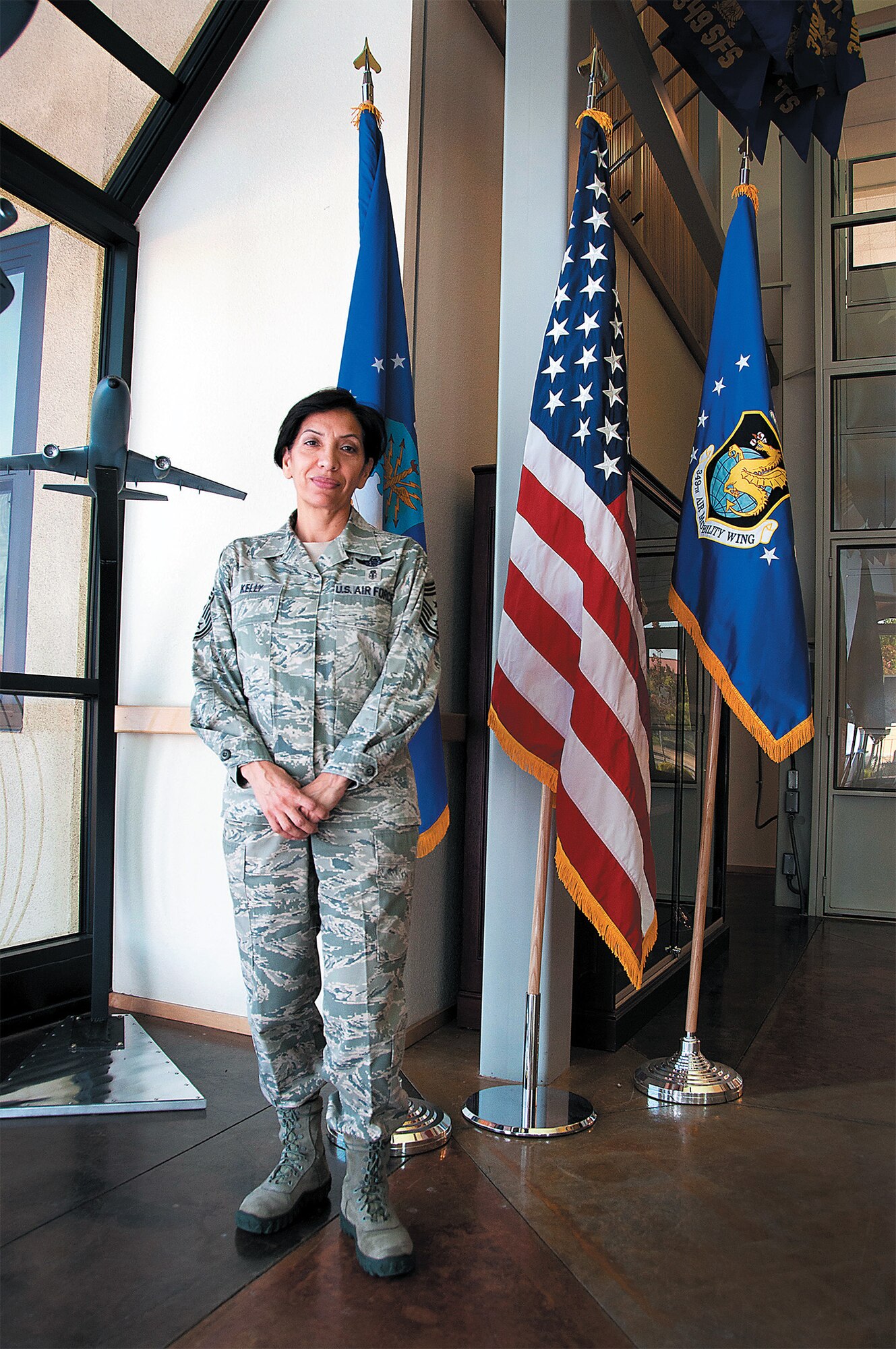 TRAVIS AIR FORCE BASE, Calif. -- Chief Master Sgt. Ericka Kelly, 349th Air Mobility Wing command chief, stands in the entrance to the 349th Wing command building June 9 on Travis. (U.S. Air Force photo/Staff Sgt. Patrick Harrower)
