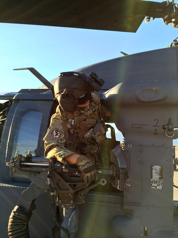 Senior Airman Scott Garner, special mission aviator with the 305th Rescue Squadron, prepares for an air-refueling exercise June 19, 2014. In conjunction with its wartime mission of combat search and rescue, the Pave Hawk is used for civil search and rescue, emergency aeromedical evacuation disaster relief and counterdrug activities. (U.S. Air Force photo/2nd Lt. Anna-Marie Wyant)