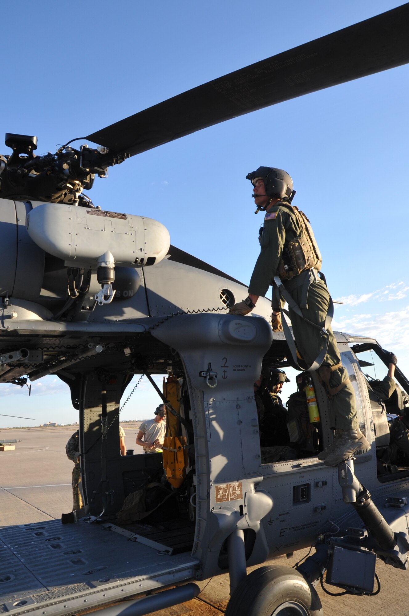 Tech. Sgt. Caleb Hiner, a special mission aviator with the 305th Rescue Squadron, Davis-Monthan Air Force Base, Ariz., checks the rotors on an HH-60G Pave Hawk helicopter prior to an air-refueling exercise June 19, 2014. The primary mission of the Pave Hawk is to conduct day or night combat-search-and-rescue operations into hostile environments to recover downed air crew or other isolated personnel during war. (U.S. Air Force photo/Senior Airman Natasha Dowridge)