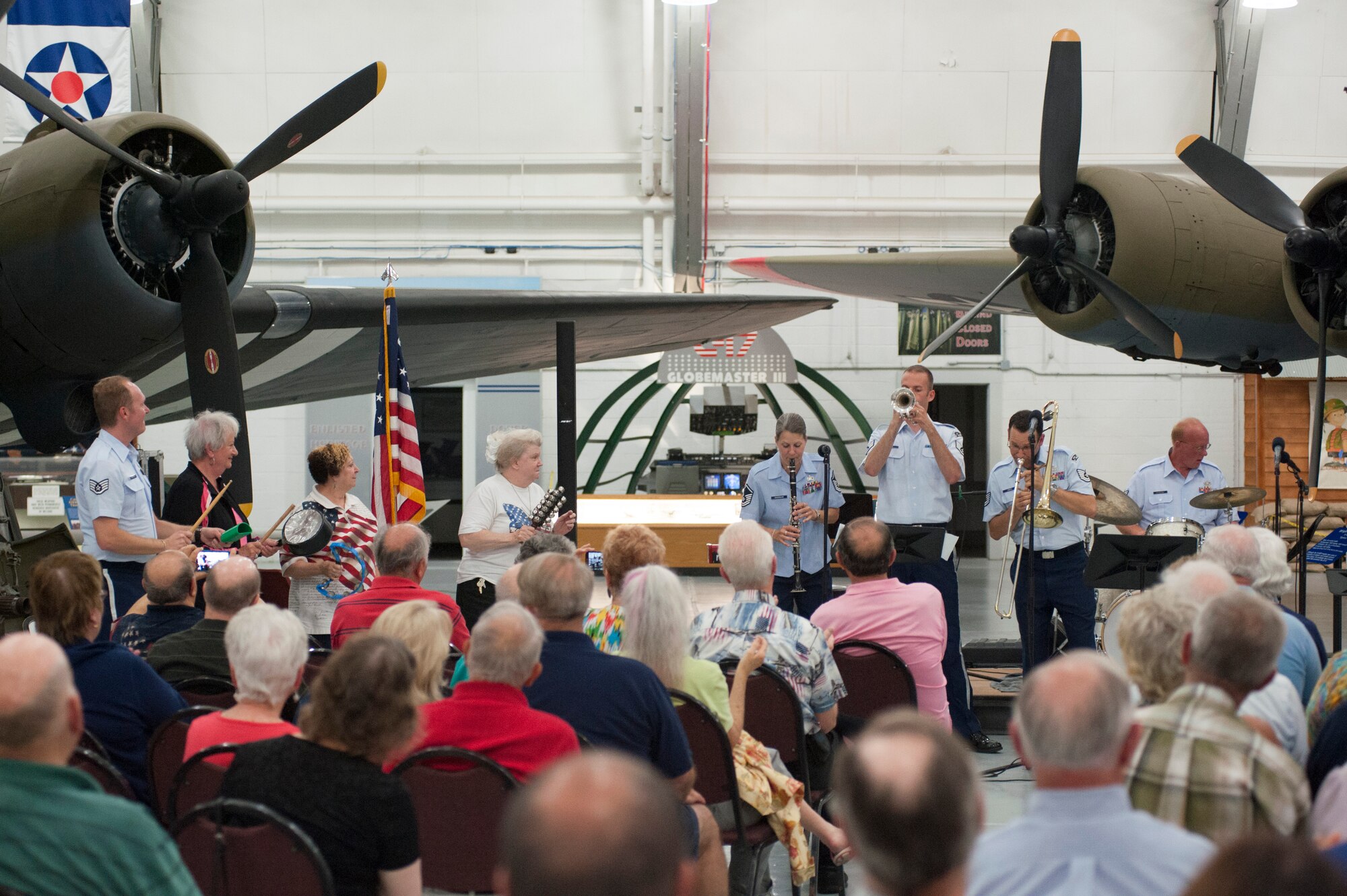 U.S. Air Force Heritage of America Band Heritage Ramblers, play during a free event, for audience members, June 14, 2014, at the Air Mobility Command Museum on Dover Air Force Base, Del. The Heritage Ramblers were formed in 2010 with a mission to preserve and present the rich heritage of traditional jazz. (U.S. Air Force photo/Senior Airman Jared Duhon)