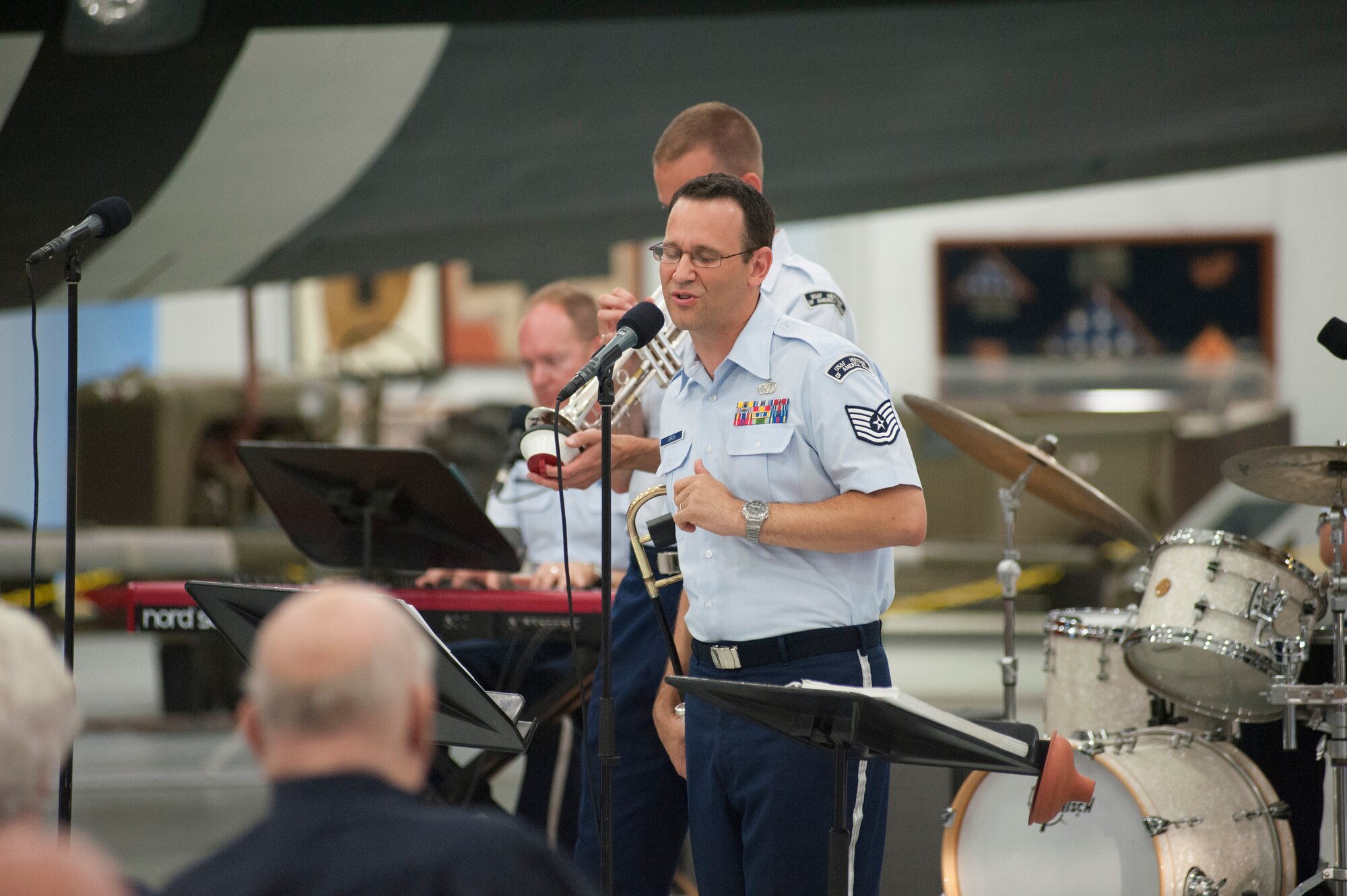 Tech. Sgt. John Garcia, Heritage Ramblers singer and trombone player, sings during a free event June 14, 2014, at the Air Mobility Command Museum on Dover Air Force Base, Del. The Air Force Heritage Ramblers, a part of the Heritage Band of America, band played New Orleans style jazz in observance of Flag Day. (U.S. Air Force photo/Senior Airman Jared Duhon) 