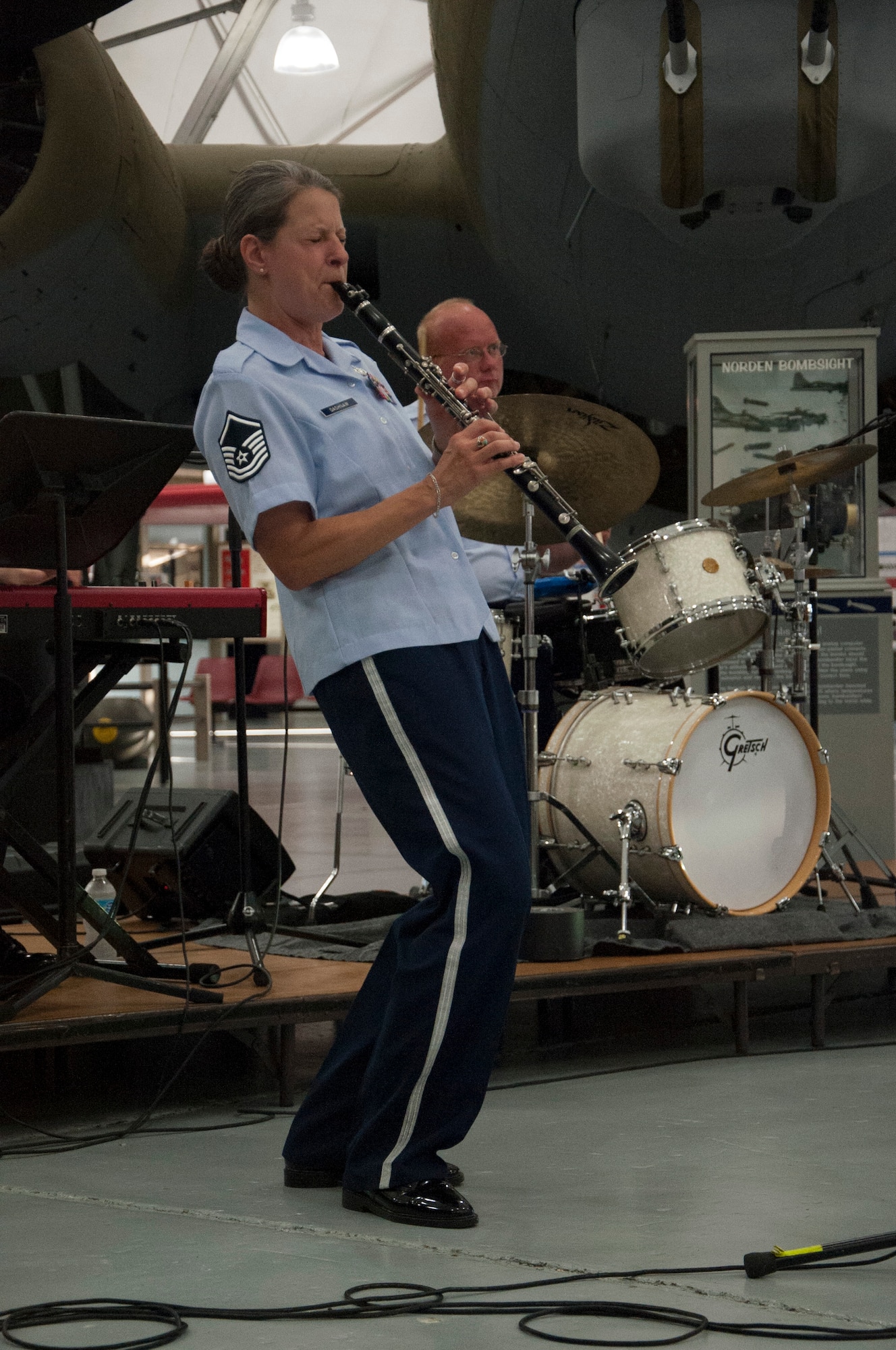 Master Sgt. Jennifer Dashraw, Heritage Ramblers singer and clarinet player, plays for audience members during a free event June 14, 2014, at the Air Mobility Command Museum on Dover Air Force Base, Del. The Heritage Ramblers brought the New Orleans and Chicago styles of traditional jazz to more than 50 people. (U.S. Air Force photo/Senior Airman Jared Duhon)