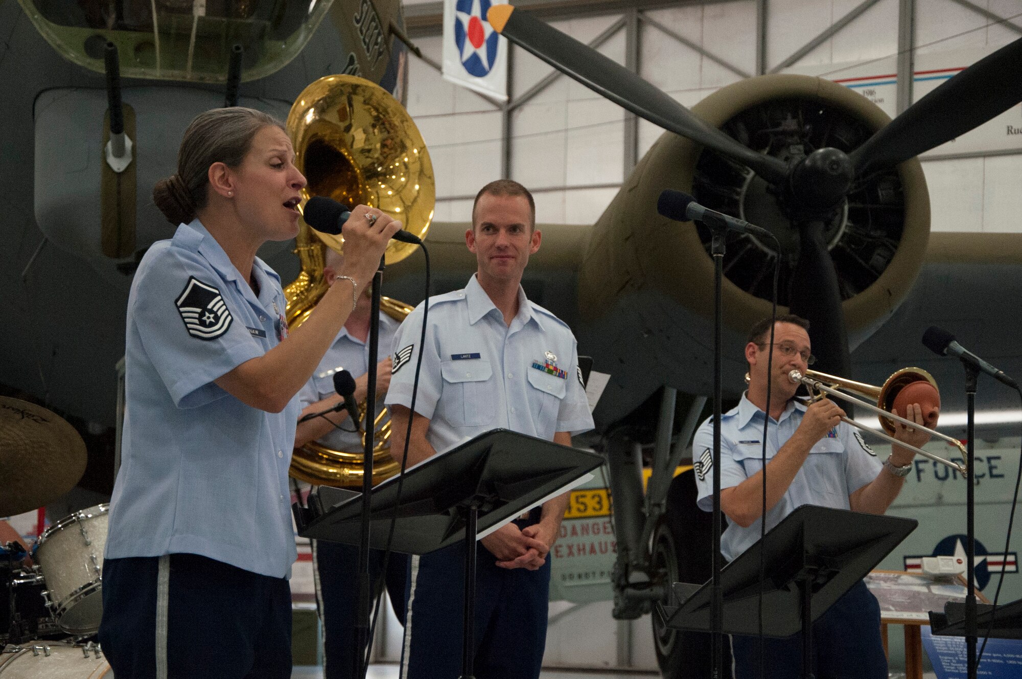 Master Sgt. Jennifer Dashraw, Heritage Ramblers singer and clarinet player, sings during a free event June 14, 2014, at the Air Mobility Command Museum on Dover Air Force Base, Del. The Heritage Ramblers were formed in 2010 with a mission to preserve and present the rich heritage of traditional jazz. (U.S. Air Force photo/Senior Airman Jared Duhon)