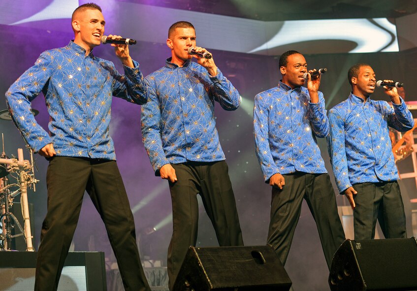 Airmen sing a series of popular pop music from the 1990’s during the Tops in Blue tour June 18, 2014 at Joint Base Lewis-McChord, Wash. Tops in Blue has traveled more than four million miles to military bases throughout the world, performed at six World Fairs, over 100 state fairs and festivals, and performed at countless air shows, military balls and special events. (U.S. Air Force photo/Senior Airman Brenden Marlin)