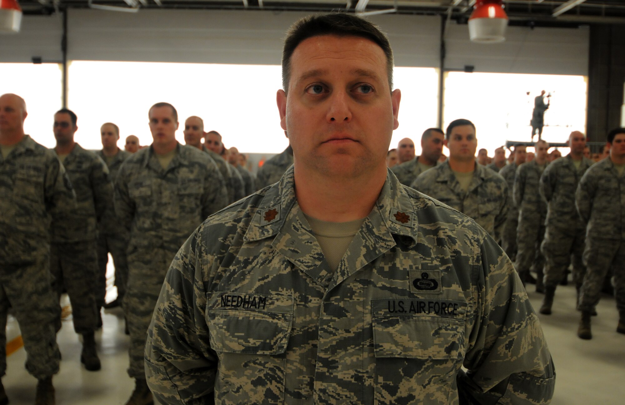 Maj. Paul Needham stands in front of the 288th Operations Support Squadron during a Conversion Day ceremony held at Ebbing Air National Guard Base, Fort Smith, Arkansas, June 7, 2014. Needham took command of the newly activated 288th OSS during the ceremony. The 188th Fighter Wing was redesignated as the 188th Wing during the event. The ceremony also recognized the many changes occurring at the wing as a result of its conversion to a remotely piloted aircraft (MQ-9 Reapers) and intelligence, surveillance and reconnaissance mission. (U.S. Air National Guard photo by Staff Sgt. Matthew Pelkey) 