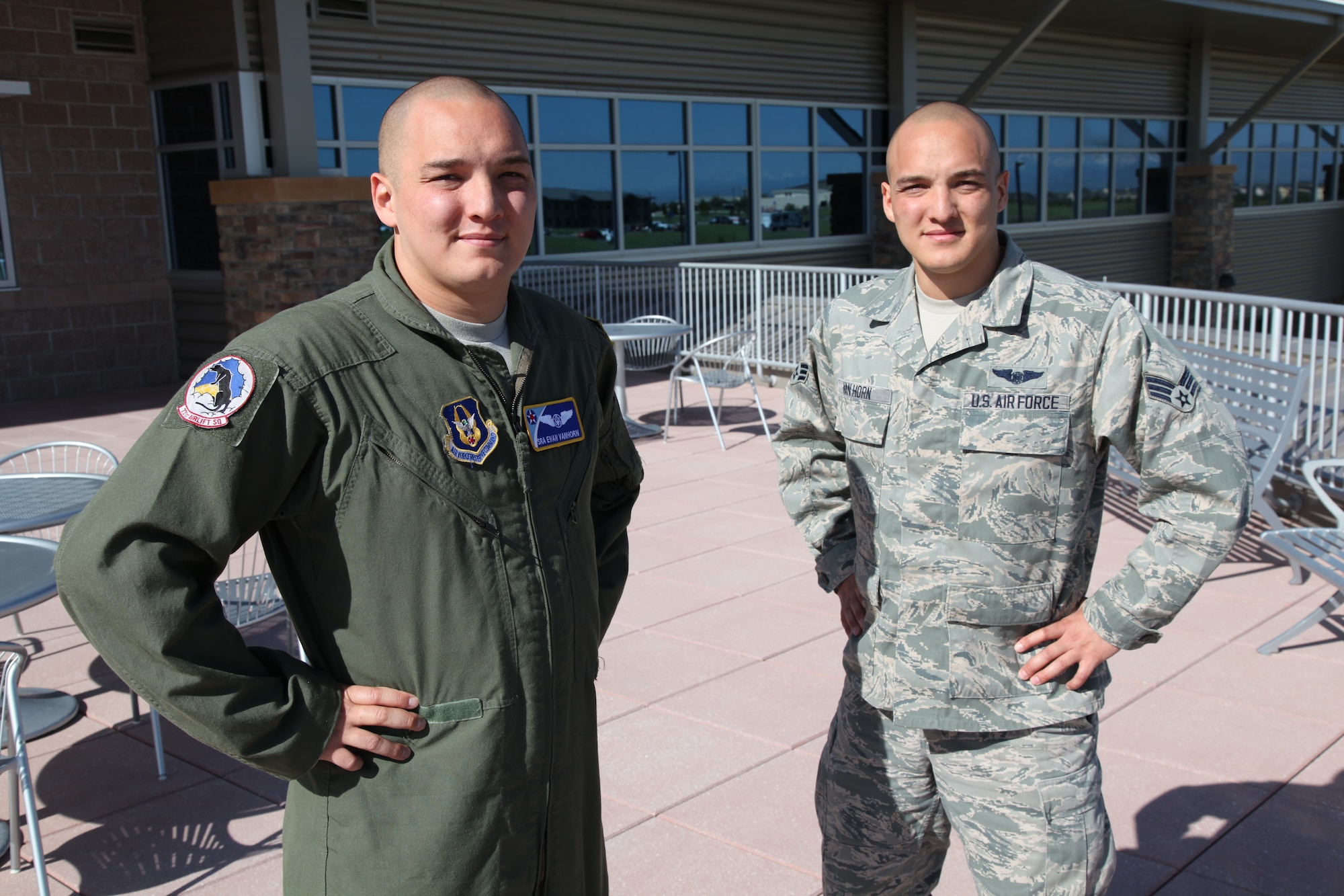 Senior Airmen Evan and Adam Van Horn stand outside the Air Reserve Personnel Center headquarters building June 17, 2014. Members at the Air Reserve Personnel Center have been seeing double since Senior Airmen Evan and Adam Van Horn were assigned here. Although the twins are fraternal, it’s difficult to tell them apart. Their journey began in May when Evan began working as a points management agent on Reserve Personnel Appropriation orders here. (U.S. Air Force photo/Tech. Sgt. Rob Hazelett)