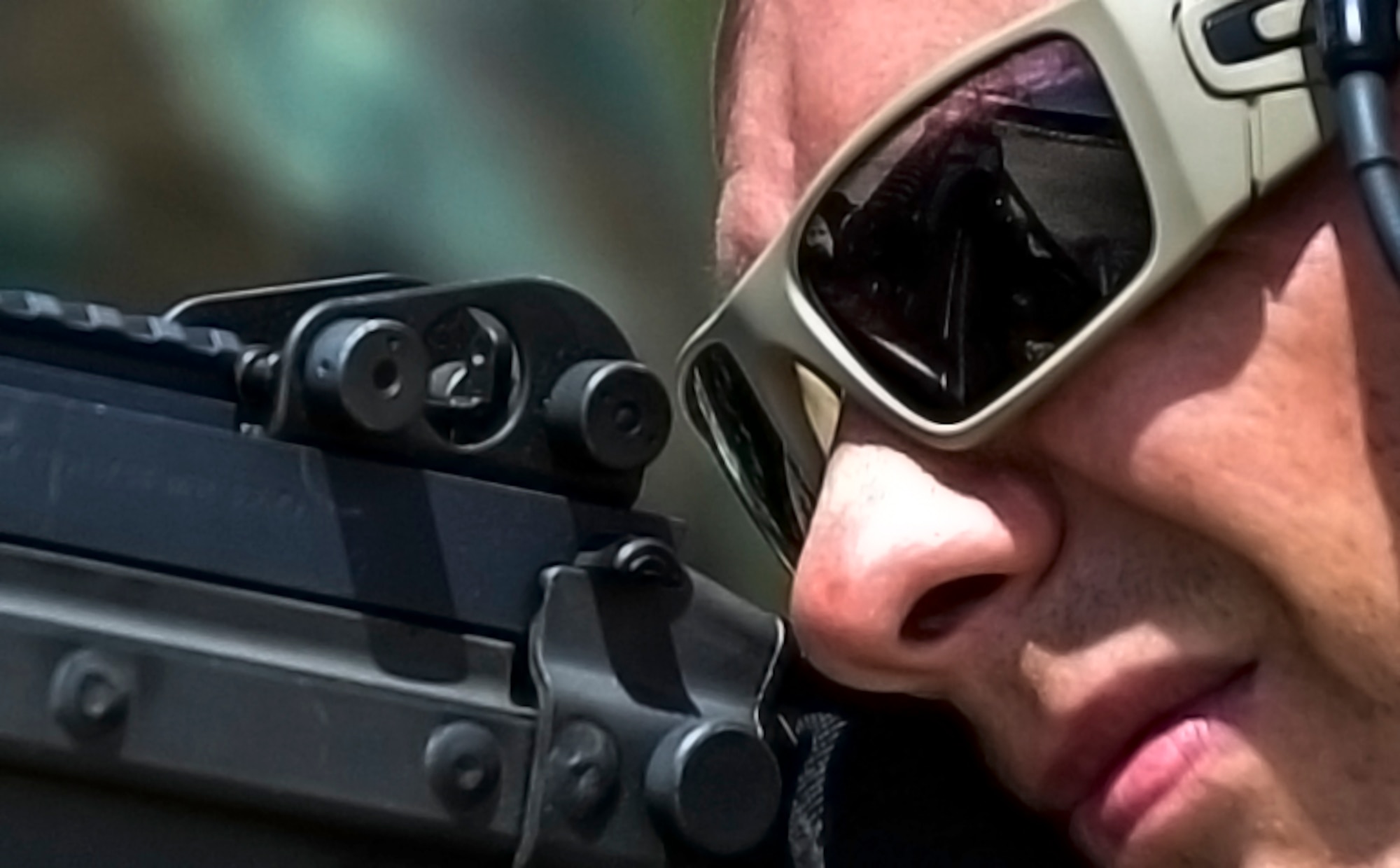 A member of the 20th Special Force Group scopes out a target on Eglin Range, Fla., June 5, 2014. Airmen and soldiers practiced weapons training, close-air support, and RAPIDS infiltrations/exfiltration. (U.S. Air Force photo/Senior Airman Christopher Callaway)