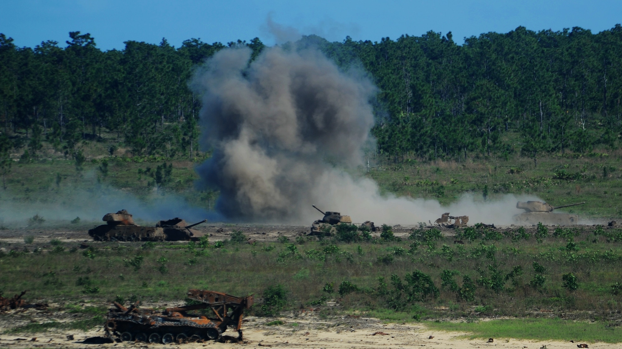 Howitzer and machine gun fire hit their mark during close-air support training on Eglin Range, Fla., June 5, 2014. An AC-130 “Spooky” gunship fired the rounds. (U.S. Air Force photo/Airman 1st Class Nicholas Koetz)