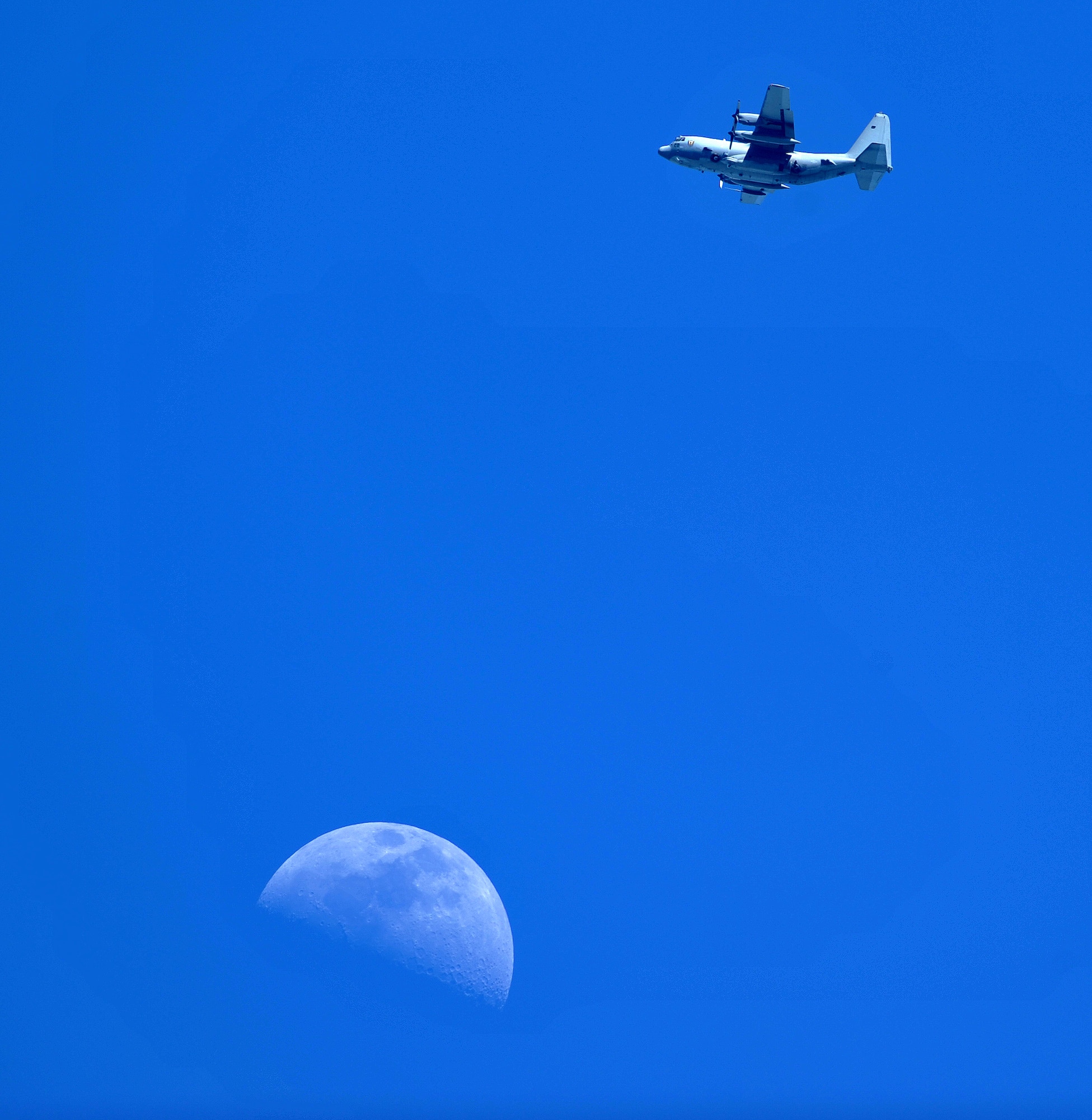 An AC-130 “Spooky” gunship flies overhead, providing close-air support to members of the 20th Army Special Force Group during joint weapons training on Eglin Range, Fla., June 5, 2014.  “It’s a little bit different for them to integrate with us than they would with fast movers like F-16s, B-1s and A-10s, but it’s better if they see it during training,” said 1st Lt. Allen  Caleb, 4th Special Operations Squadron Spooky navigator. (U.S. Air Force photo/Senior Airman Kentavist P. Brackin)