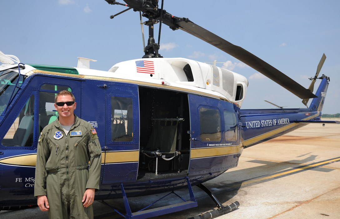 Staff Sgt. Mark Cornett, 1st Helicopter Squadron special mission aviator instructor, stands in front of a UH-1N Huey helicopter assigned to the 1st Helicopter Squadron on Joint Base Andrews, Md., June 17, 2014. Cornett was deployed to Afghanistan from December 2012 – December 2013. (U.S. Air Force photo/Airman 1st Class Ryan J. Sonnier)