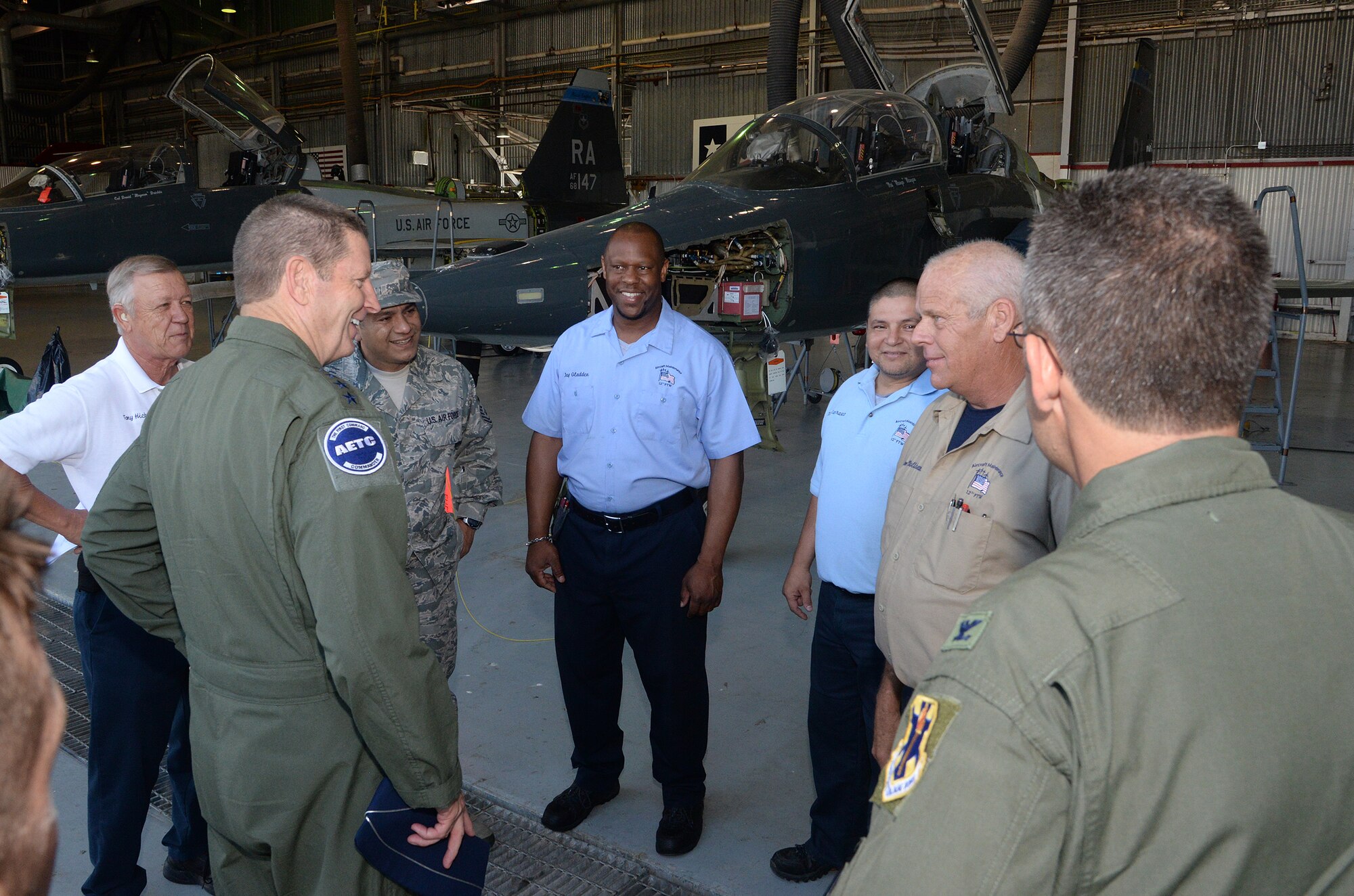 Gen. Robin Rand, commander, Air Education and Training Command, speaks with members of the 12th Flying Training Wing Maintenance Directorate, Joint Base San Antonio-Randolph, Texas, June 13, 2014. Rand, Col. Gerald Goodfellow, commander, 12th Flying Training Wing , and Chief Master Sgt. Gerardo Tapia, AETC command chief, met with leadership, toured several 12th FTW squadrons, and spoke with 12 FTW Airmen during a commander’s “all call”  after a site visit of the 12th Flying Training Wing. (U.S. Air Force photo by Johnny Saldivar)