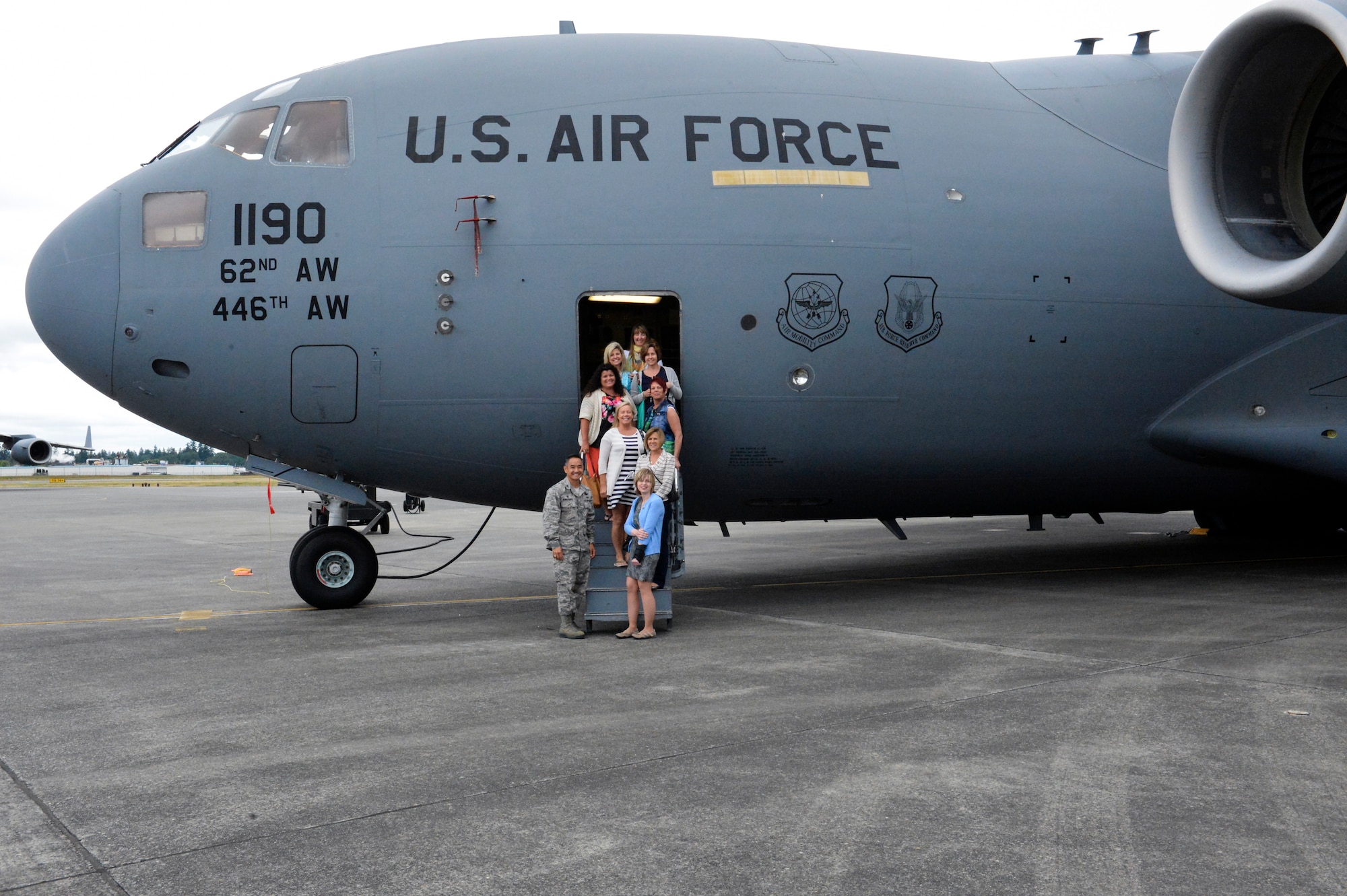 Col. David Kumashiro, 62nd Airlift Wing commander, takes the I Corps Team of senior spouses on a personal tour of a C-17 Globemaster III aircraft June 12, 2014, at Joint Base Lewis-McChord, Wash. The ladies enjoyed the opportunity to meet with Kumashiro and learn about the C-17 from pilots stationed here. (U.S. Air Force photo/Staff Sgt. Russ Jackson) 