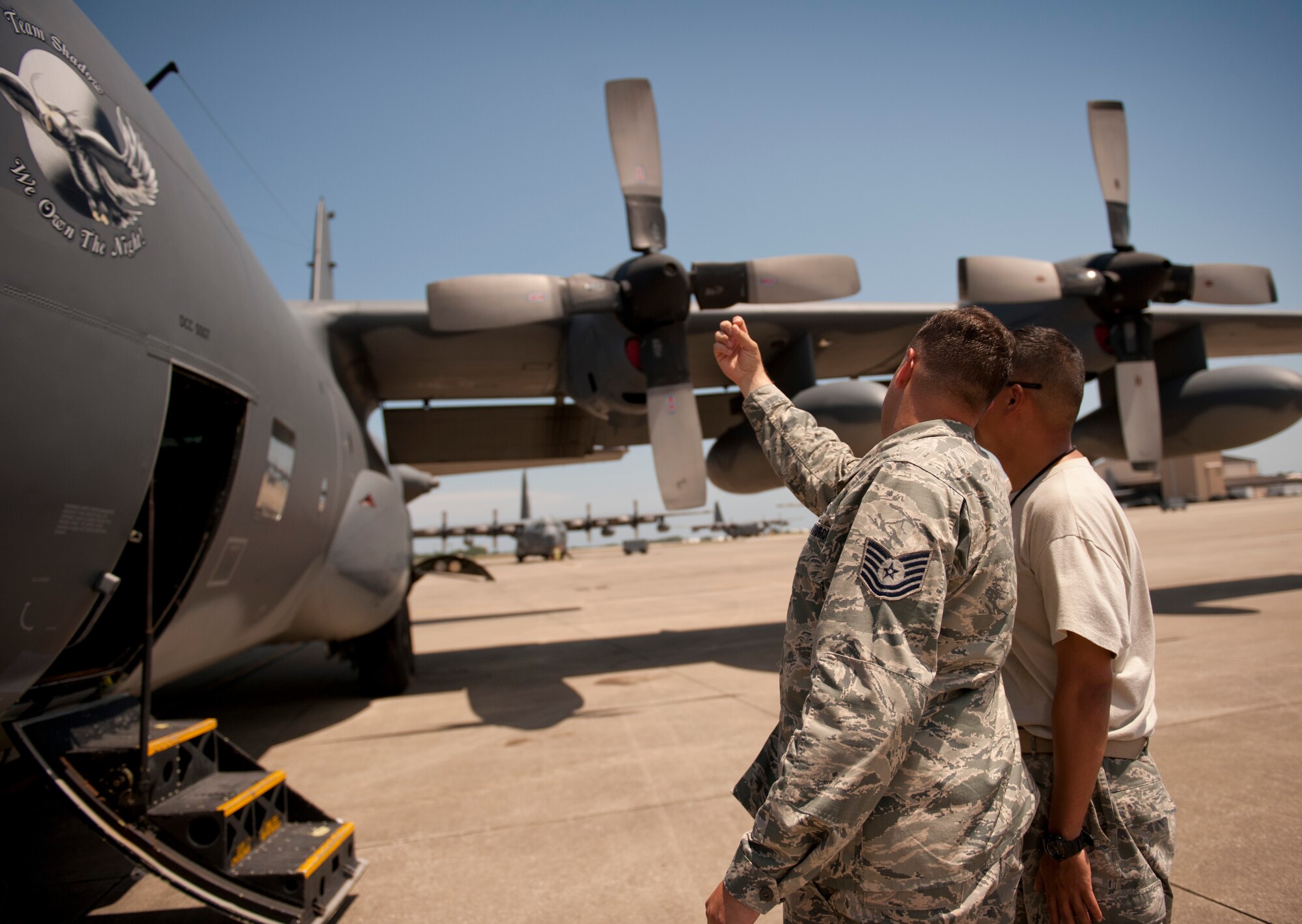 Tech. Sgt. Tony Peel, 1st Special Operations Wing flight safety NCO, discusses safety concerns with Tech. Sgt. Alfonso Ignacio, 901st Special Operations Aircraft Maintenance Squadron crew chief, on the flightline at Hurlburt Field, Fla., June 18, 2014. Peel said he roams the flightline at least three times a week to prevent safety mishaps. (U.S. Air Force photo/Senior Airman Krystal M. Garrett) 