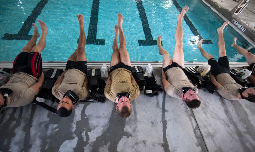 U.S. Air Force cadets perform flutter kicks during a water-confidence session at Moody Air Force Base, Ga., June 17, 2014. The water-confidence training was part of a four-day event designed to give interested cadets an idea of what combat rescue officer training is like. (U.S. Air Force photo by Senior Airman Jarrod Grammel/Released) 
