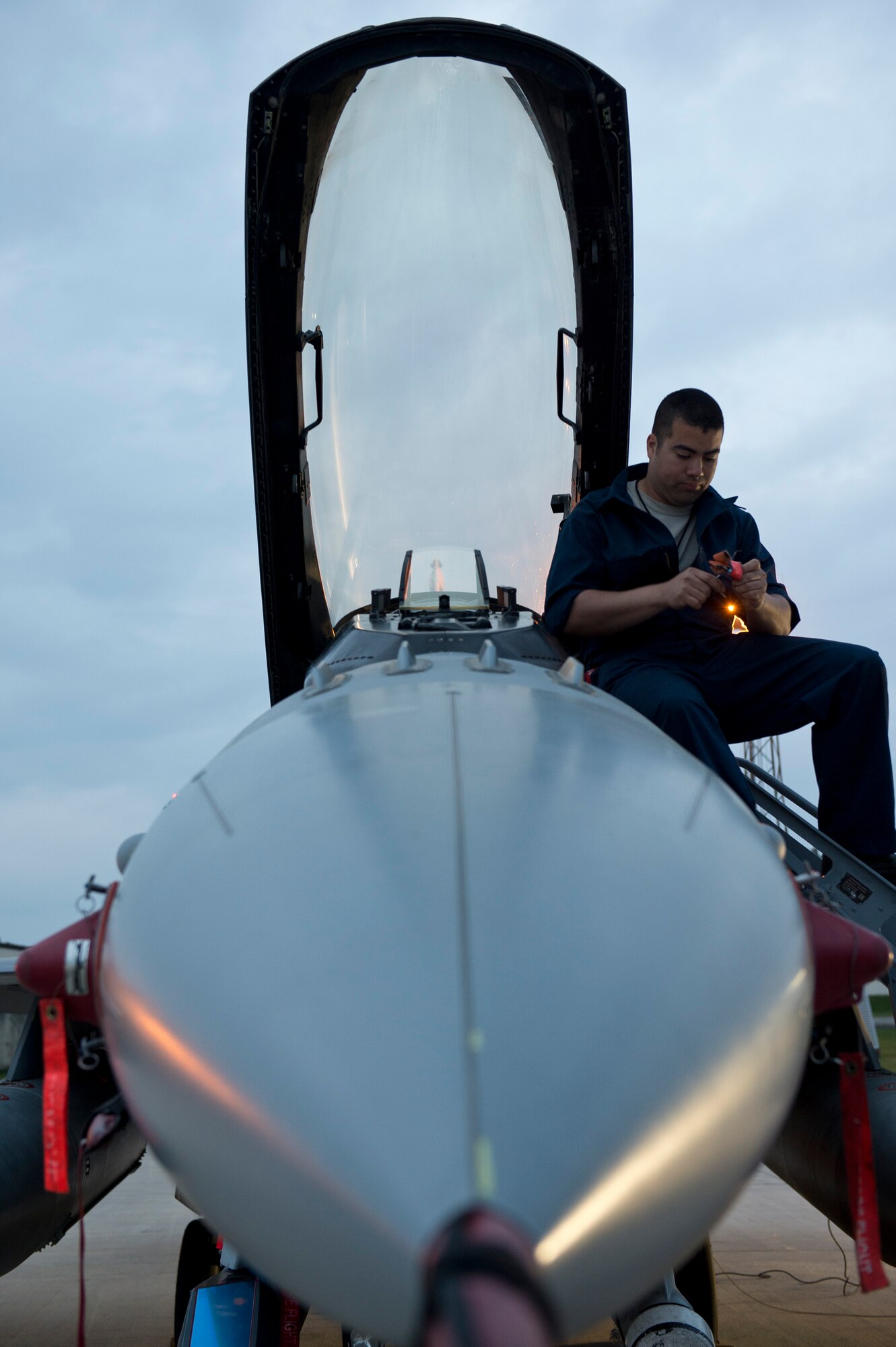 U.S. Air Force Senior Airman Miguel Dietrich, a 480th Aircraft Maintenance Unit crew chieffrom Independence, Calif., prepares a U.S. Air Force F-16 Fighting Falcon fighter aircraft cockpit prior to take-off May 1, 2014, at Spangdahlem Air Base, Germany. Rotations of military aircraft and Airmen through the U.S. Air Force Aviation Detachment, 52nd Operations Group, Lask Air Base, Poland, began in late 2012, but were augmented in March as a deliberate effort to reassure allies of U.S. commitment and solidarity to collective defense. (U.S. Air Force photo by Staff Sgt. Chad Warren/Released)