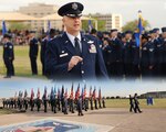 Col. Mark Camerer, 37th Training Wing commander, shown addressing the audience during a recent Air Force Basic Military Training graduation parade, will pass command of the 37th TRW to Col. Trent Edwards in a change of command ceremony Friday. (U.S. Air Force Photo Illustration by Benjamin Faske) 