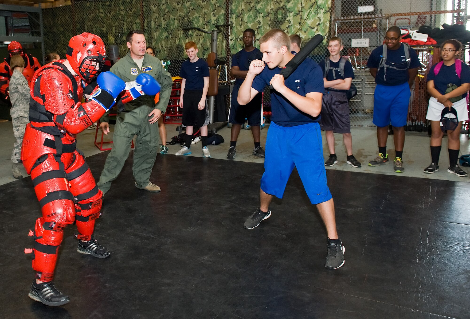 Air Force junior ROTC cadet Seth Louth, right, Smyrna High School, Smyrna, Del., prepares to battle Staff Sgt. Shane Howard, left, a 436th Security Forces Squadron Phoenix RAVEN June 18, 2014, at Dover Air Force Base, Del. Louth and other cadets took turns attacking Howard who posed as an aggressor during Armament Systems and Procedures collapsible baton training. (U.S. Air Force photo/Roland Balik)