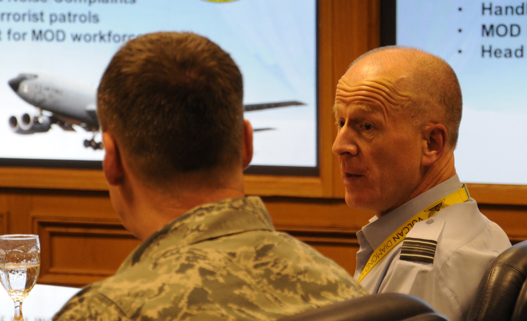 Royal Air Force Squadron Leader Rick Fryer, right, RAF Mildenhall Station commander, provides an overview of his responsibilities during a mission brief for U.S. Air Force Brig. Gen. Douglas A. Cox, U.S. Air Forces in Europe-United Kingdom director, June 20, 2014, on RAF Mildenhall, England. Cox met with Team Mildenhall leaders to learn their role in the mission and toured the base to meet with Airmen. (U.S. Air Force photo/Gina Randall/Released)