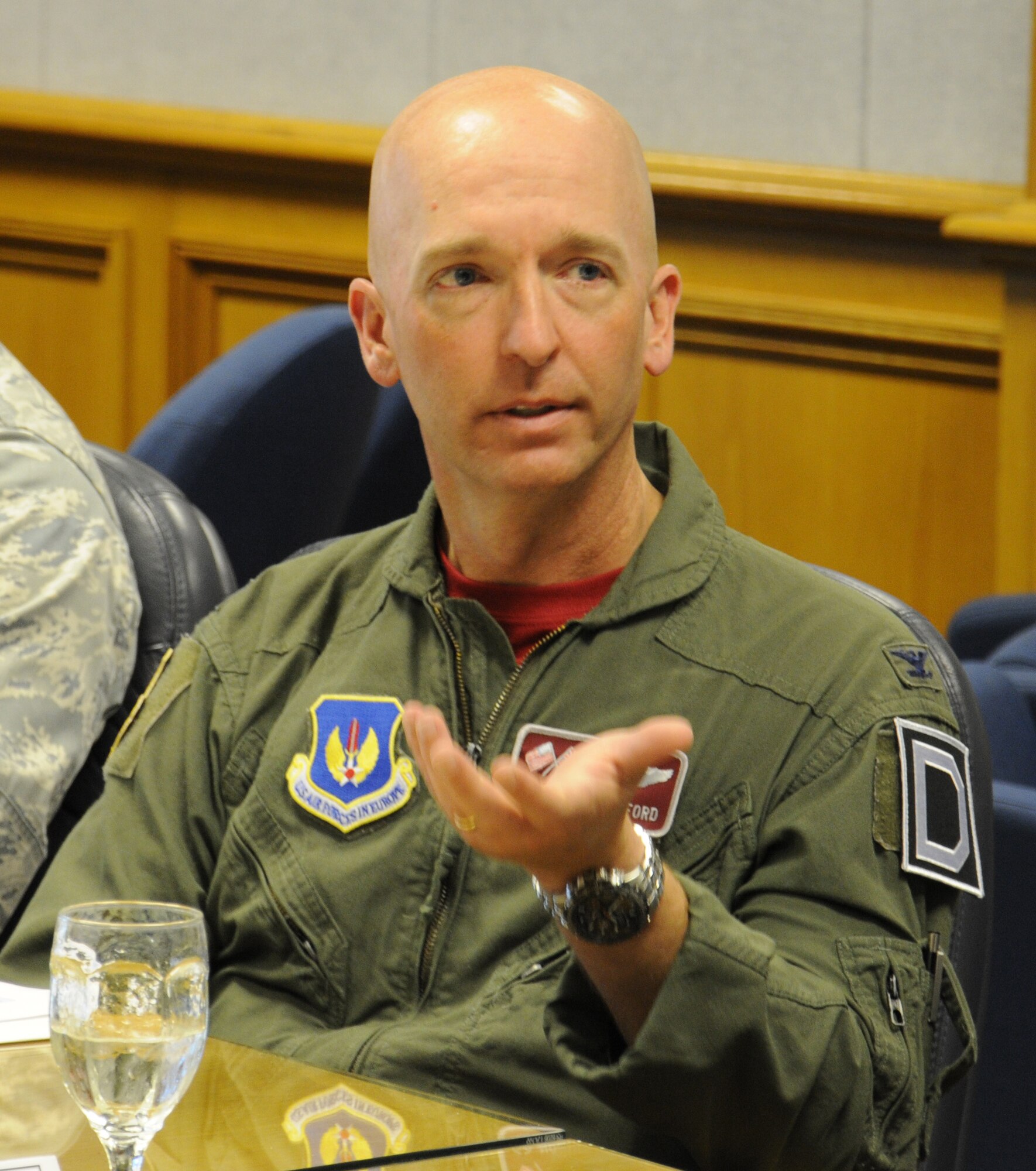 U.S. Air Force Col. Noel Bradford, 100th Operations Group commander, speaks to U.S. Air Force Brig. Gen. Douglas A. Cox, U.S. Air Forces in Europe-United Kingdom director, during a mission brief June 20, 2014, on RAF Mildenhall, England. Cox met with Team Mildenhall leaders to learn their role in the mission and toured the base to meet with Airmen. (U.S. Air Force photo/Gina Randall/Released)