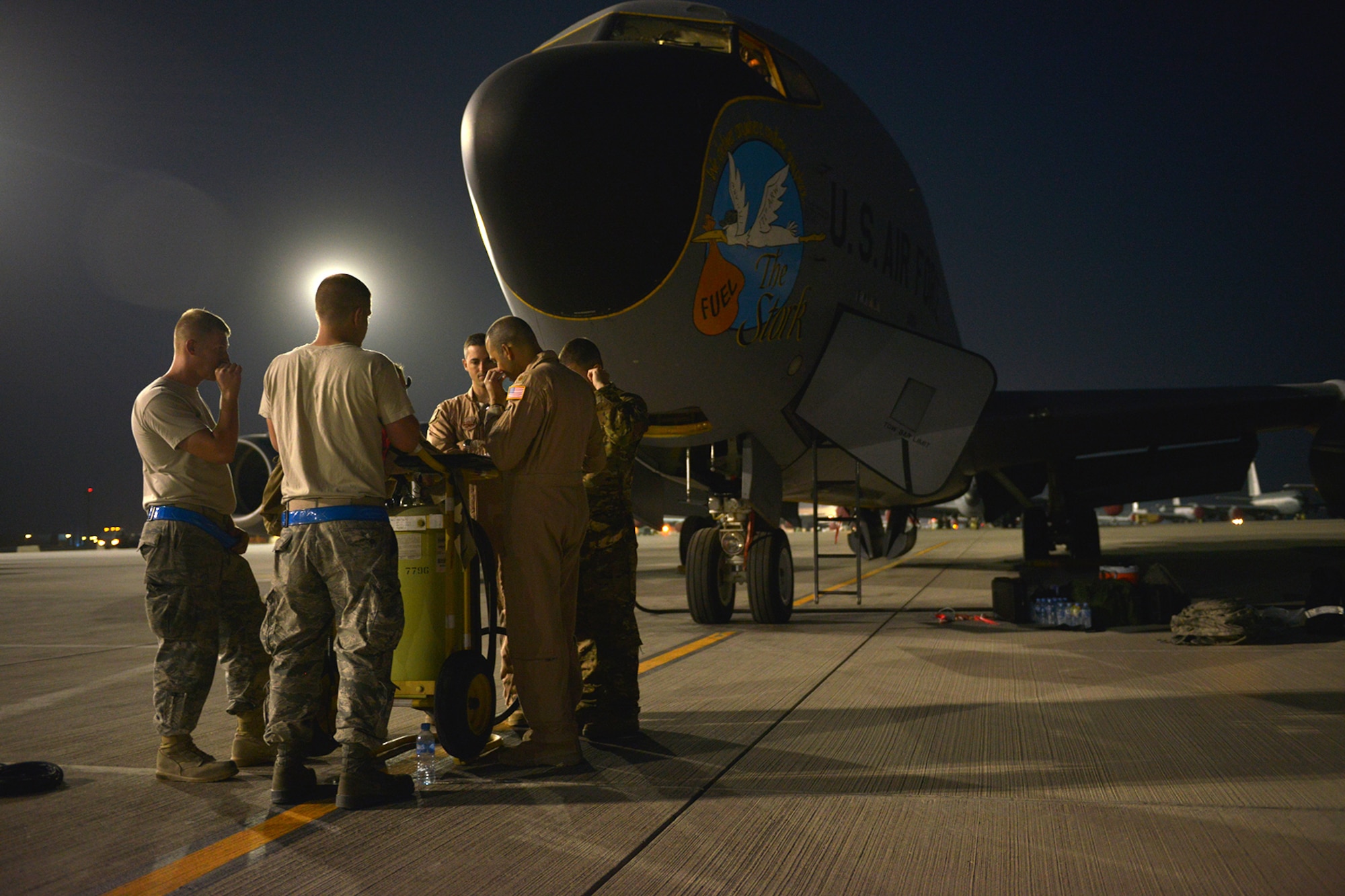 U.S. Air Force Airmen assigned to the 340th Expeditionary Air Refueling Squadron prepare for a refueling mission at Al Udeid Air Base, Qatar, June 20, 2014. The squadron is responsible for 60% of the fuel in U.S. Air Forces Central Command’s area of responsibility. (U.S. Air Force photo by Staff Sgt. Ciara Wymbs) 